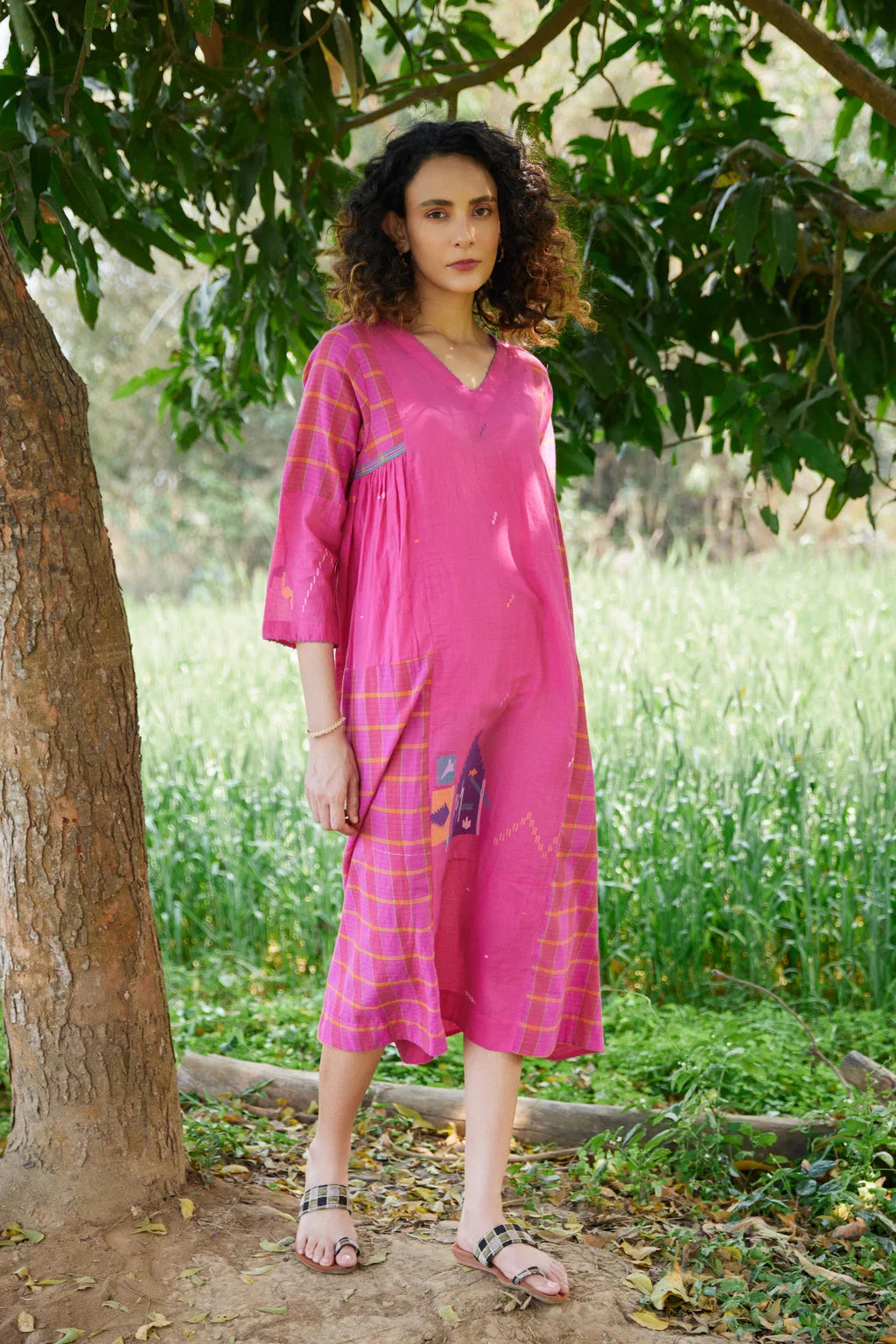 Sarron Amoli Dress, pink cotton Jamdani maxi dress with solid and checked panels and waist smocking.