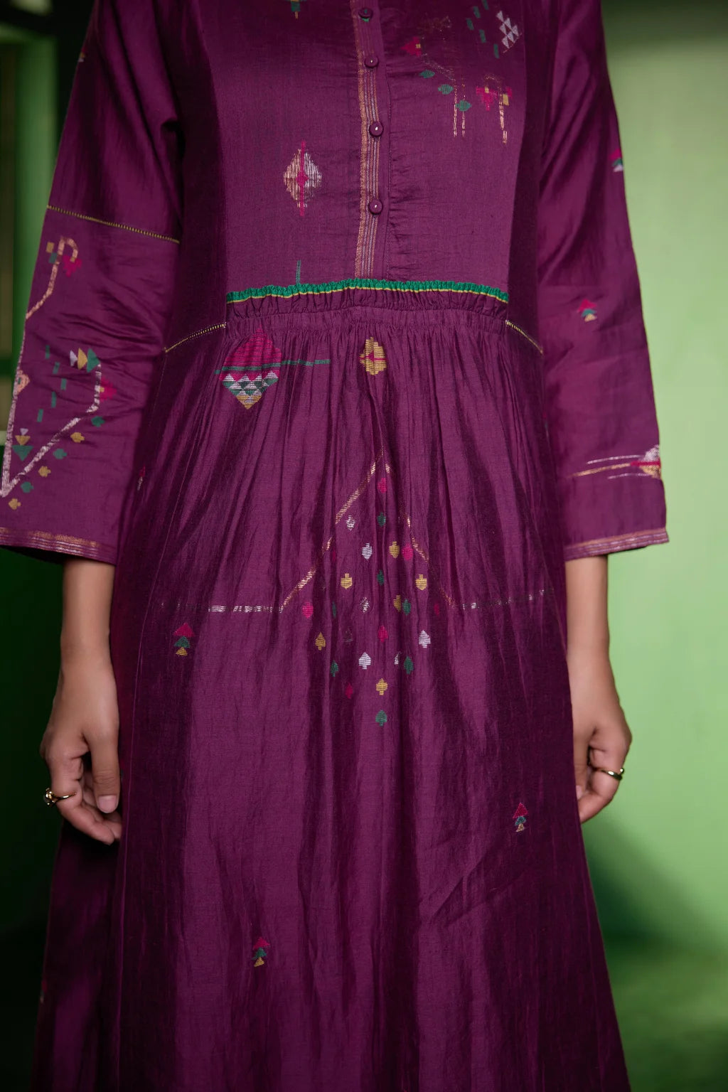 Sarron Amrita Dress, plum purple silk-cotton Jamdani dress with geometric motifs and a gathered waist.