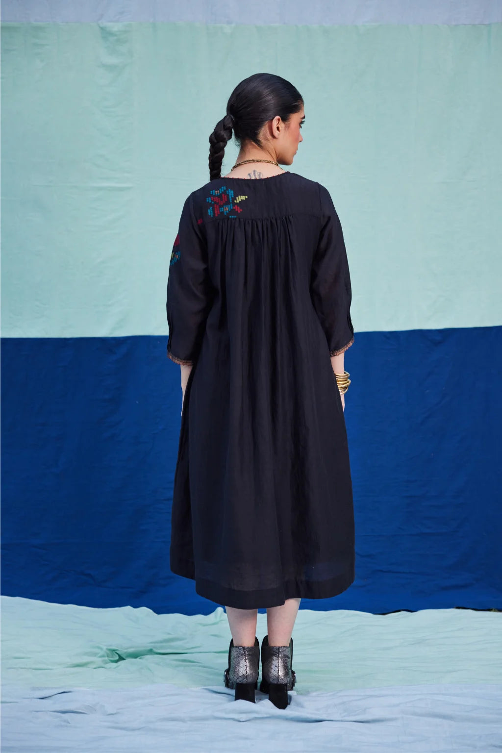 Sarron Bindu Dress, black silk-cotton Jamdani dress with large multicoloured graph butas and pintucks.