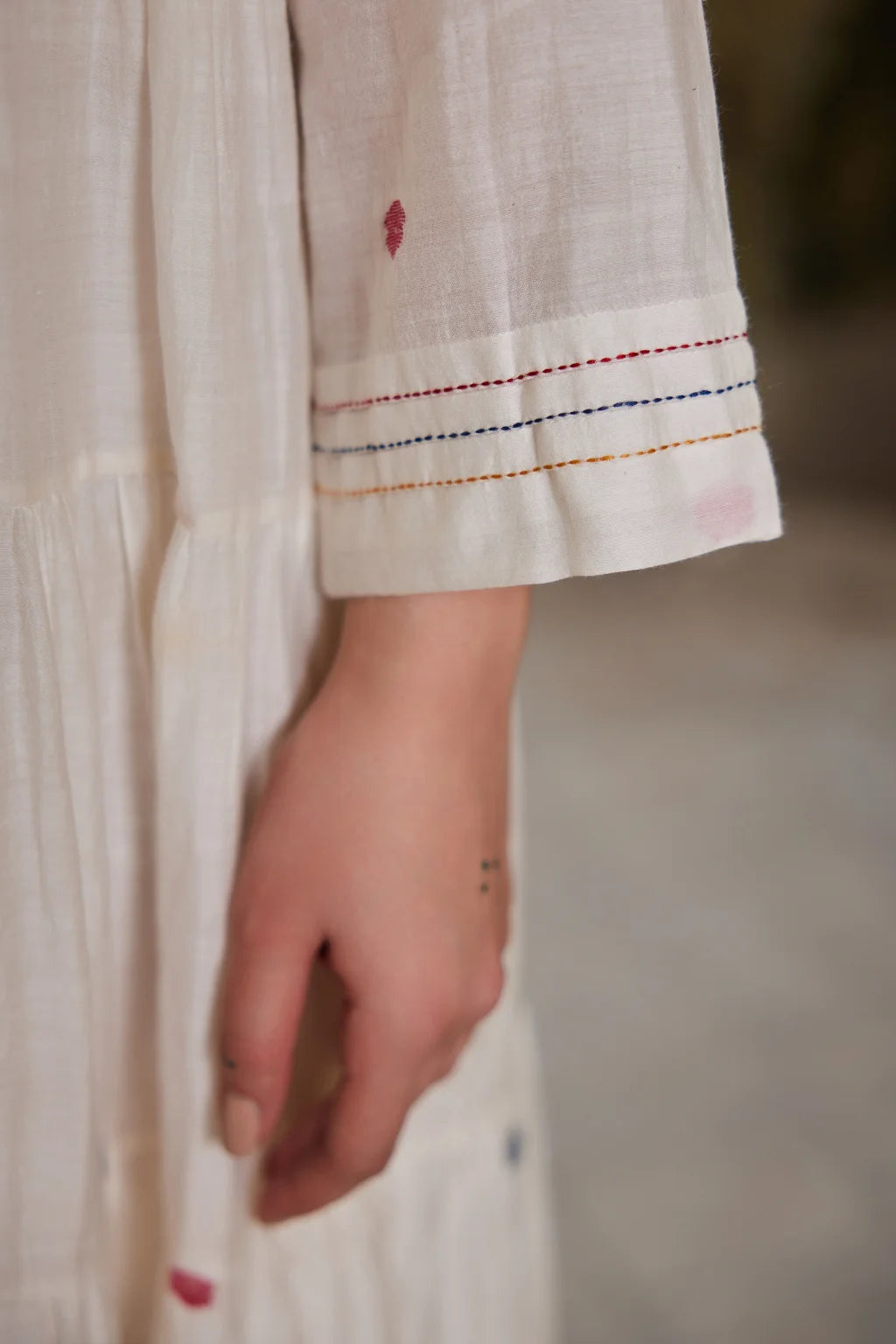 Sarron Gauri Dress, white tiered silk-cotton Jamdani dress with a floral placement motif and Kantha embroidery.