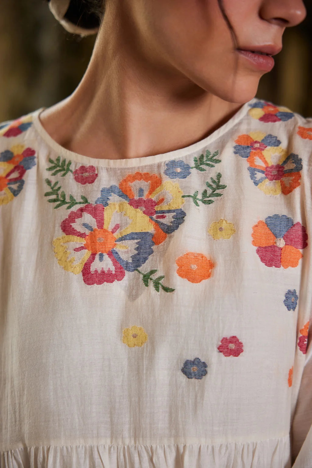Sarron Gauri Dress, white tiered silk-cotton Jamdani dress with a floral placement motif and Kantha embroidery.