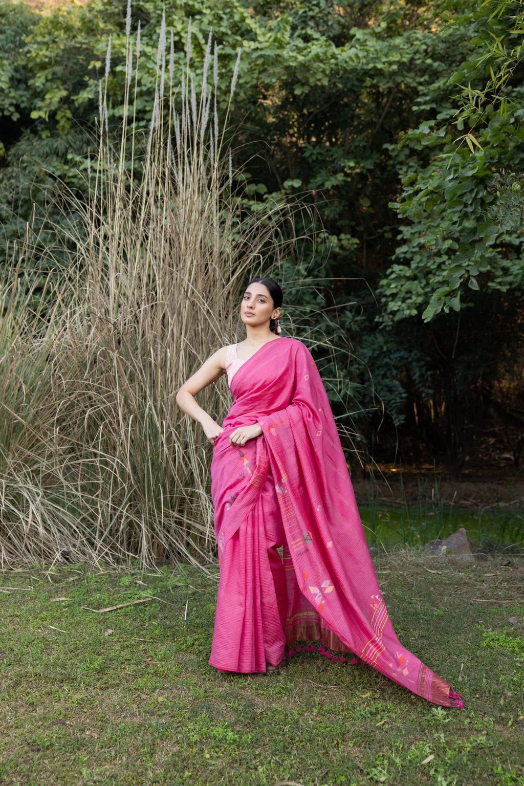 Sarron Gulabi-001 Saree, pink zari-striped silk-cotton Jamdani saree with peacock and tiger motifs.