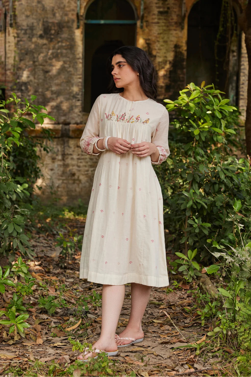 Sarron Khanak Dress, off-white cotton Jamdani dress with red and copper zari motifs and floral hand embroidery.