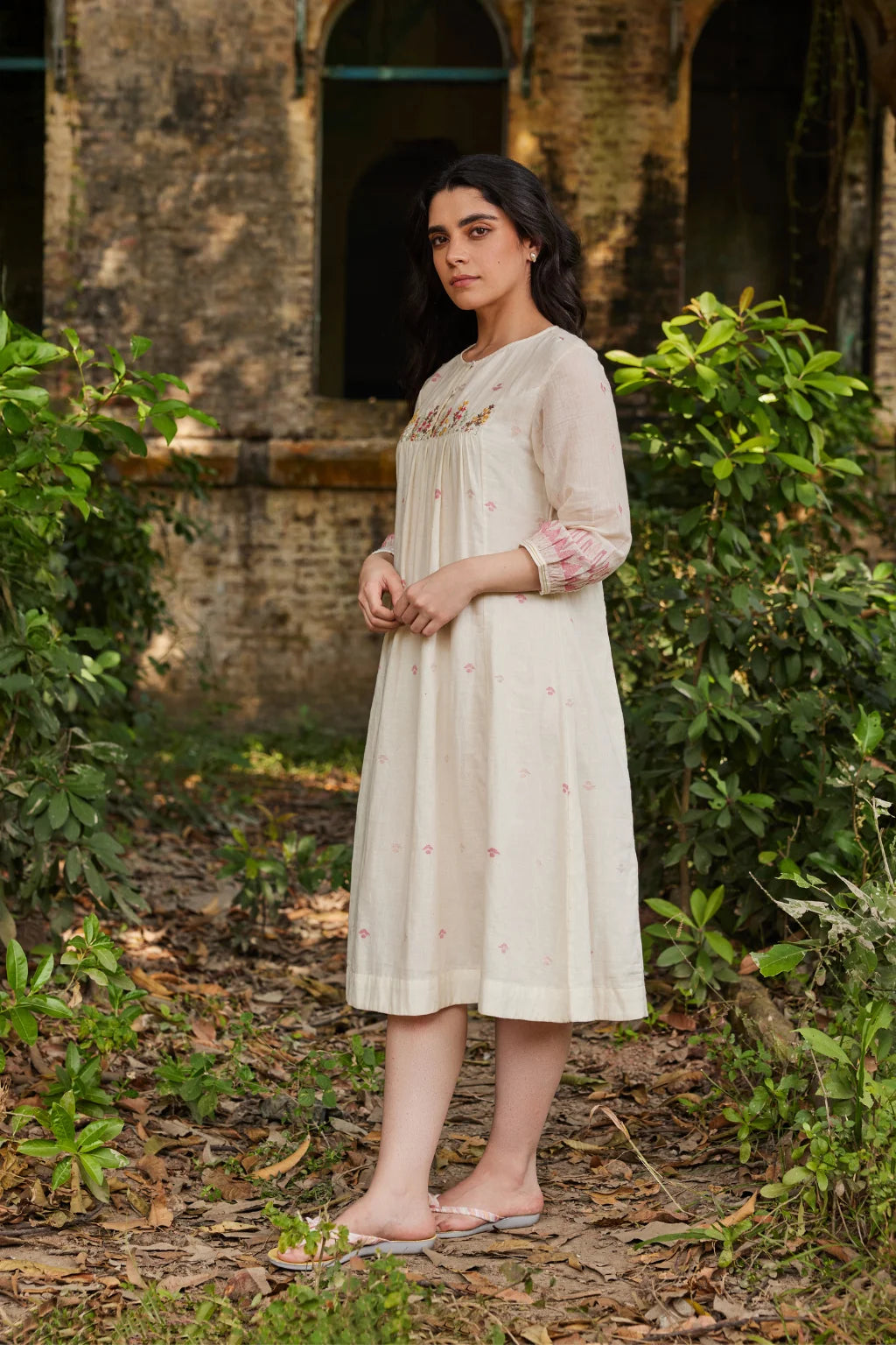 Sarron Khanak Dress, off-white cotton Jamdani dress with red and copper zari motifs and floral hand embroidery.