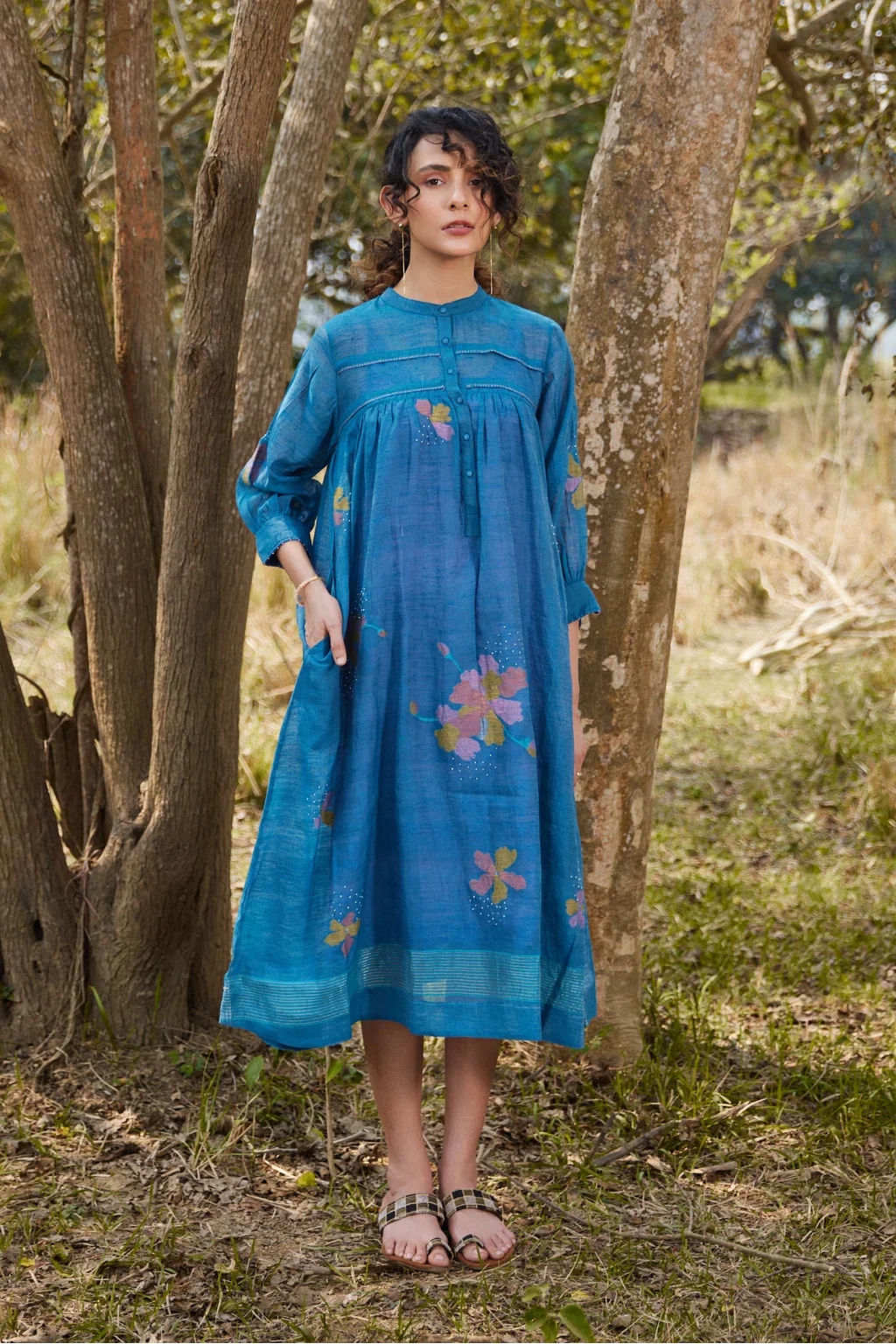 Sarron Krishna Dress, blue silk-cotton Jamdani dress with handwoven floral motifs and a pleated fall.