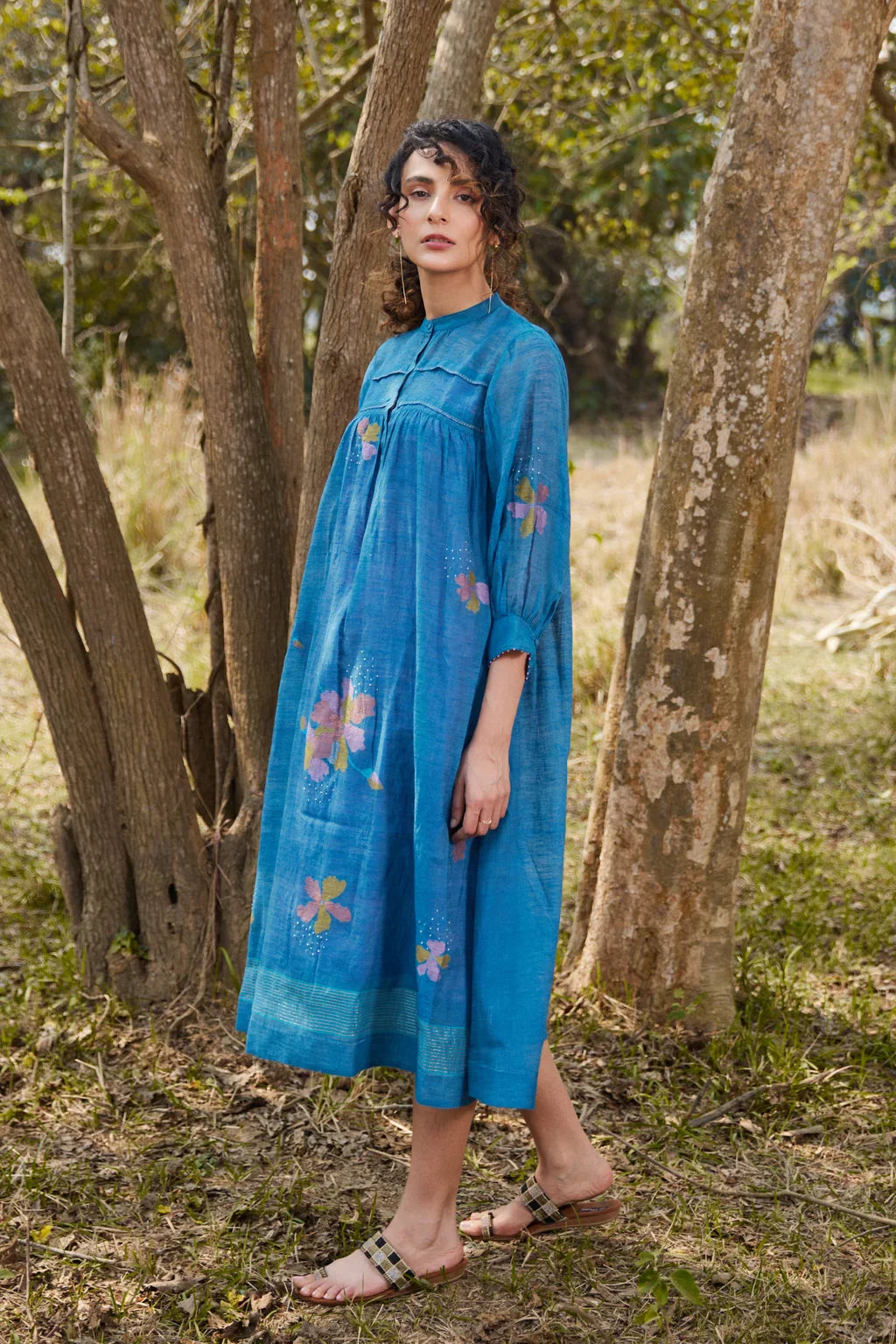 Sarron Krishna Dress, blue silk-cotton Jamdani dress with handwoven floral motifs and a pleated fall.