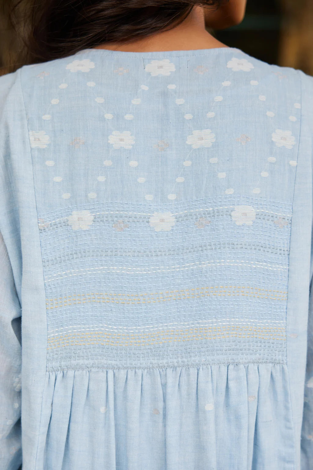 Sarron Kusum Dress, light blue cotton Jamdani dress with white and gold zari floral motifs.