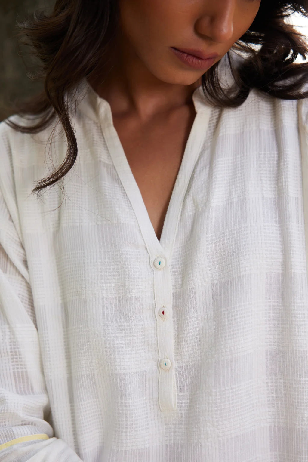 Sarron Lalitha Dress, white patchwork dress in cotton check and cotton Jamdani with geometric motifs.