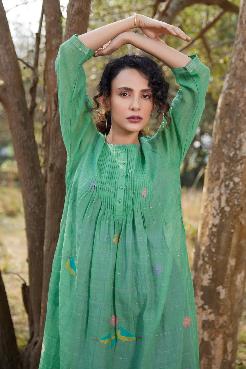 Sarron Mamata Dress, green silk-cotton Jamdani dress with sheer three-quarter sleeves and golden hem work.