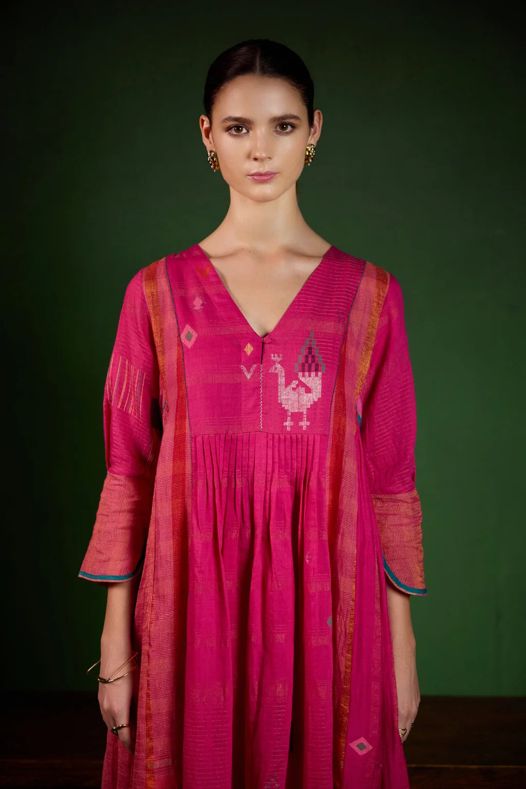 Sarron Mayura Dress, fuchsia pink silk-cotton Jamdani dress with handwoven peacock motifs and zari stripes.