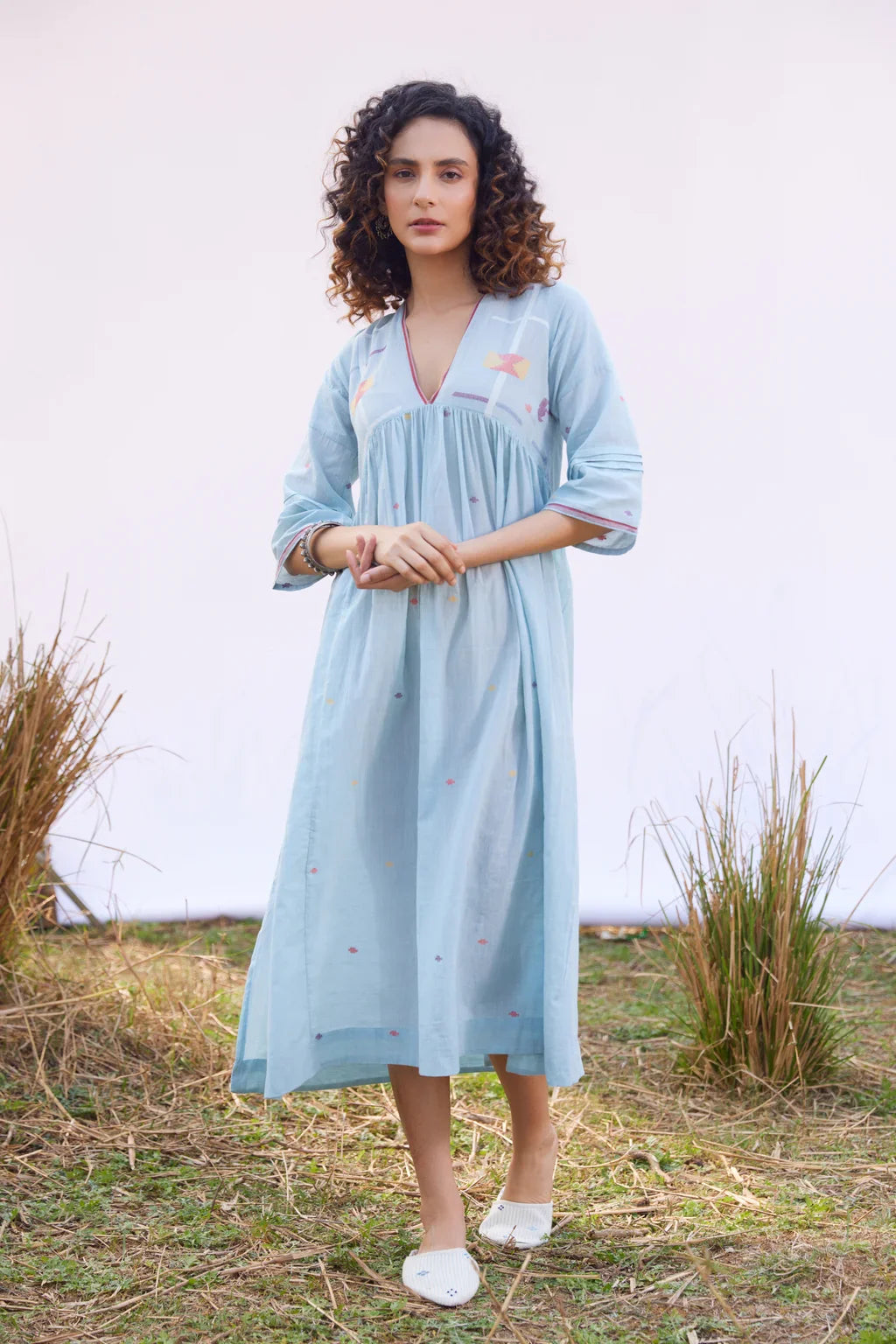 Sarron Meghna Dress, light indigo cotton Jamdani dress with a V-neckline and handwoven Jamdani motifs.