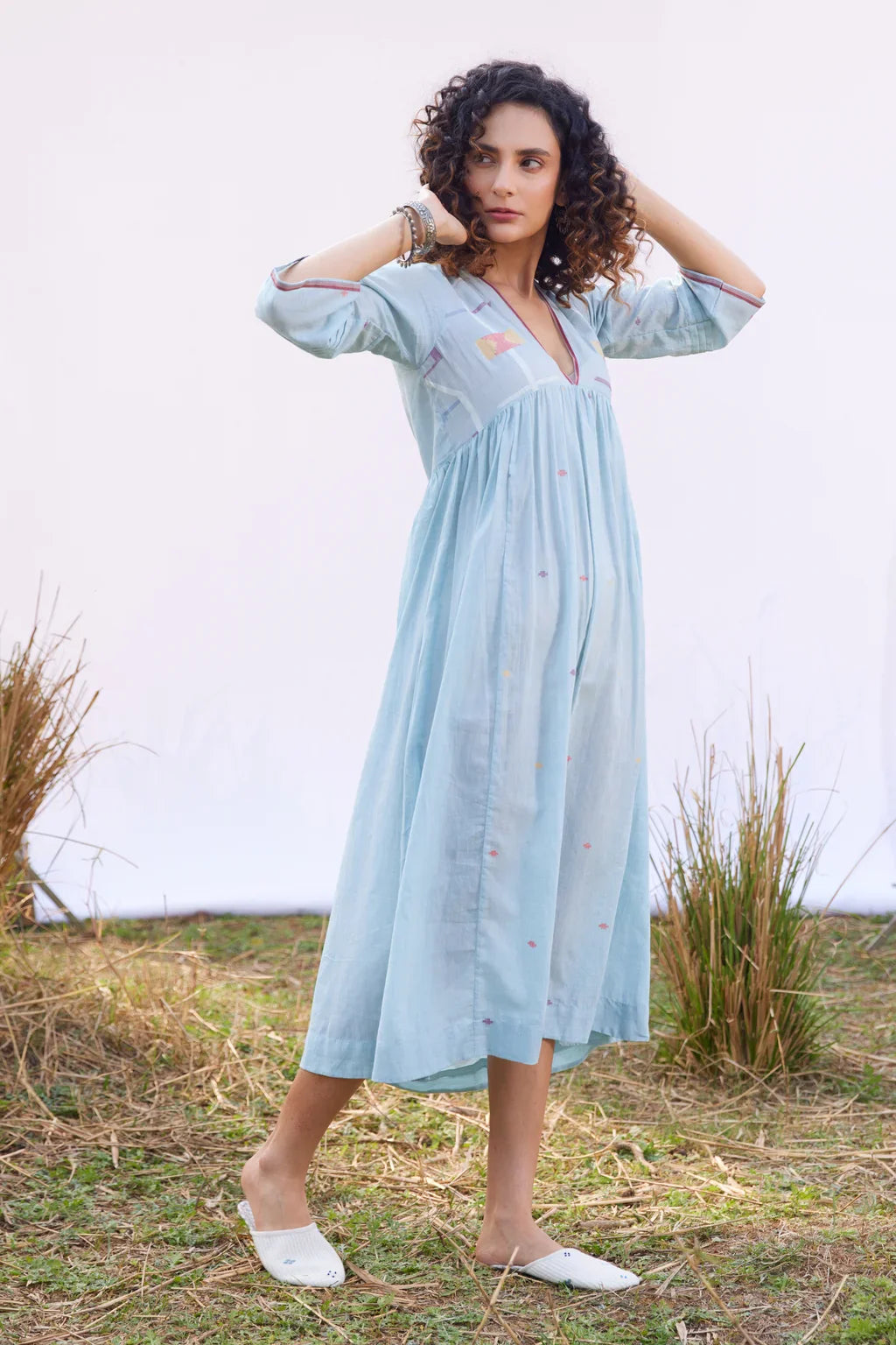 Sarron Meghna Dress, light indigo cotton Jamdani dress with a V-neckline and handwoven Jamdani motifs.