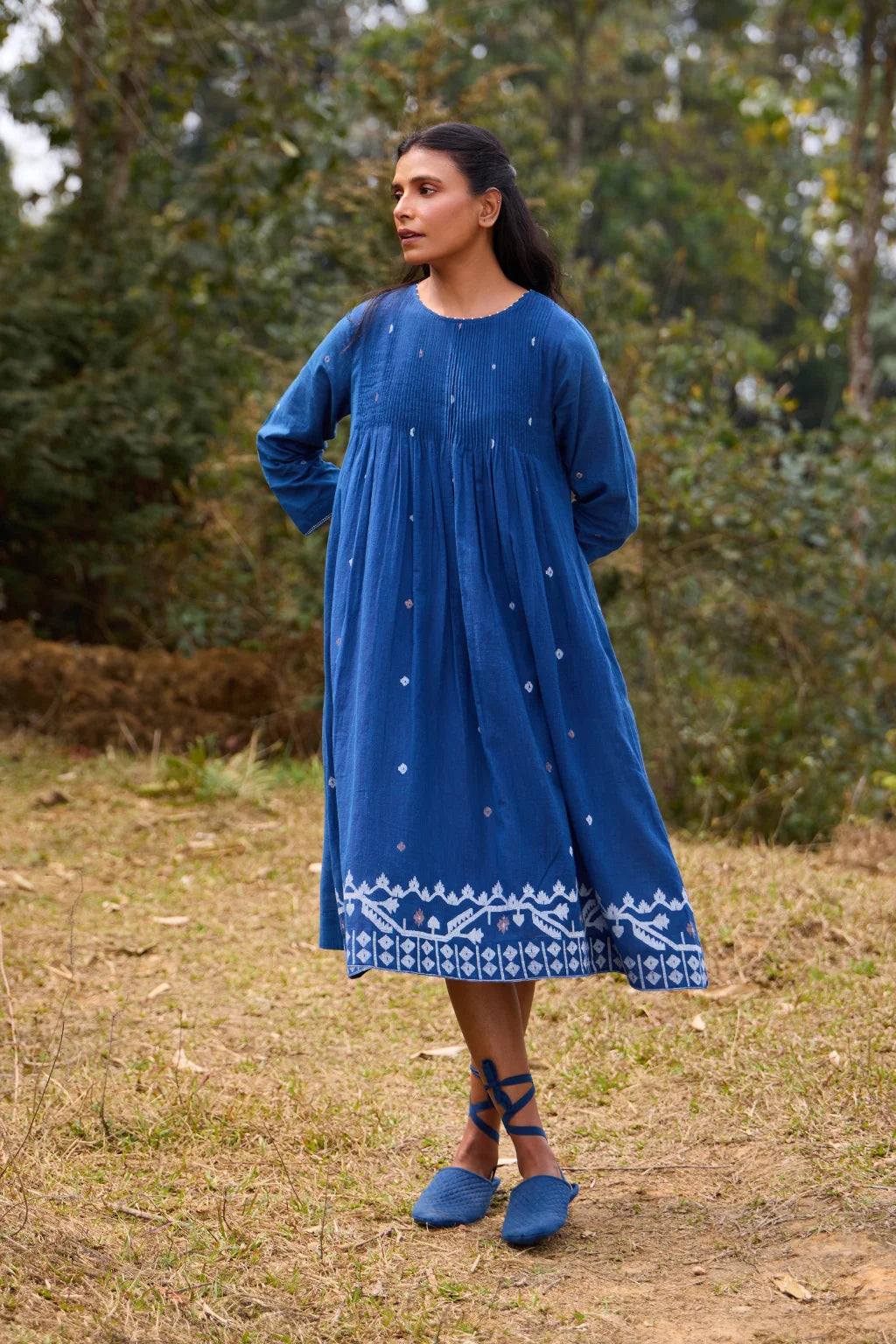Sarron Neelpadma Dress, deep indigo cotton Jamdani flare dress with geometric hem motifs and pintucks.