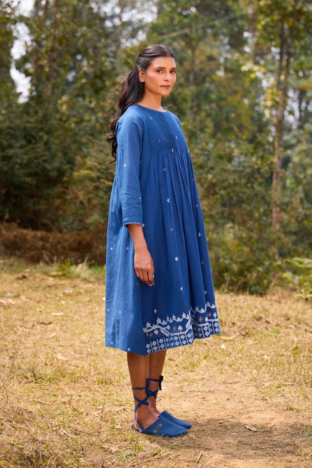 Sarron Neelpadma Dress, deep indigo cotton Jamdani flare dress with geometric hem motifs and pintucks.