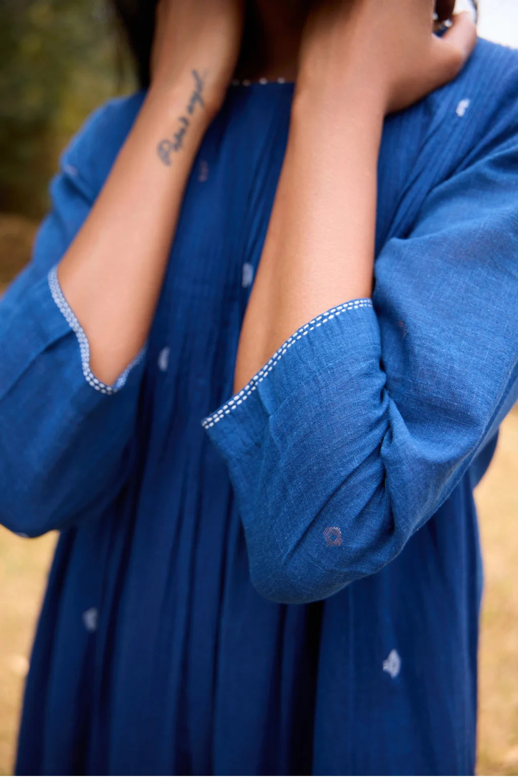 Sarron Neelpadma Dress, deep indigo cotton Jamdani flare dress with geometric hem motifs and pintucks.