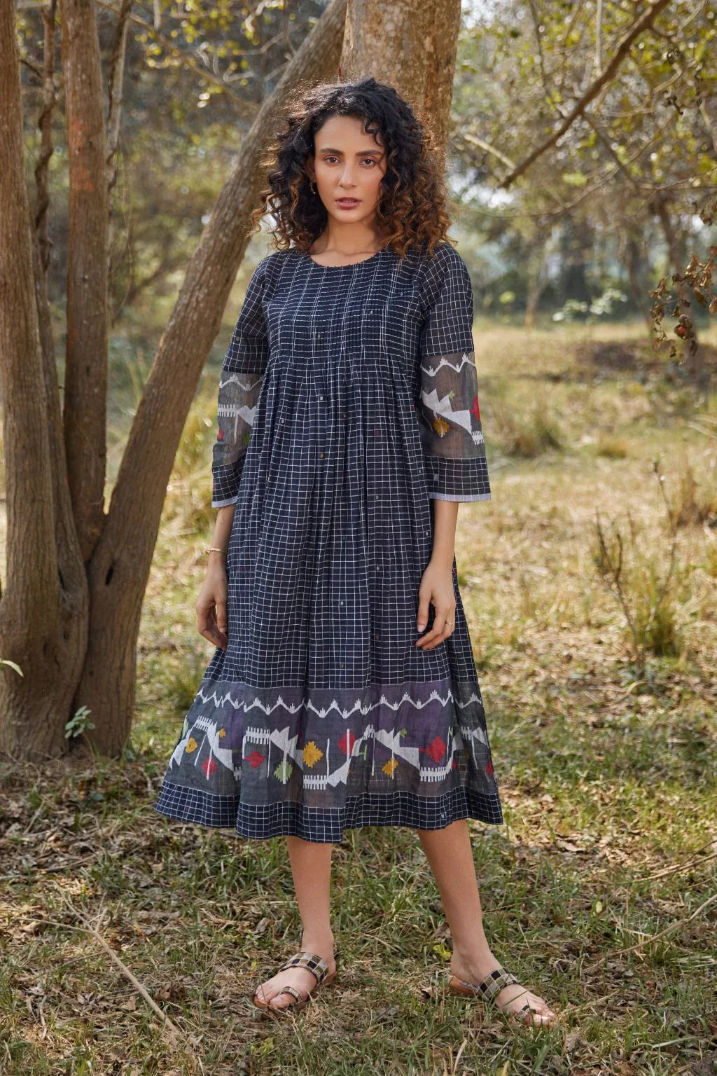Sarron Nisha Dress, black cotton Jamdani dress with a white checked weave and centre pleats.