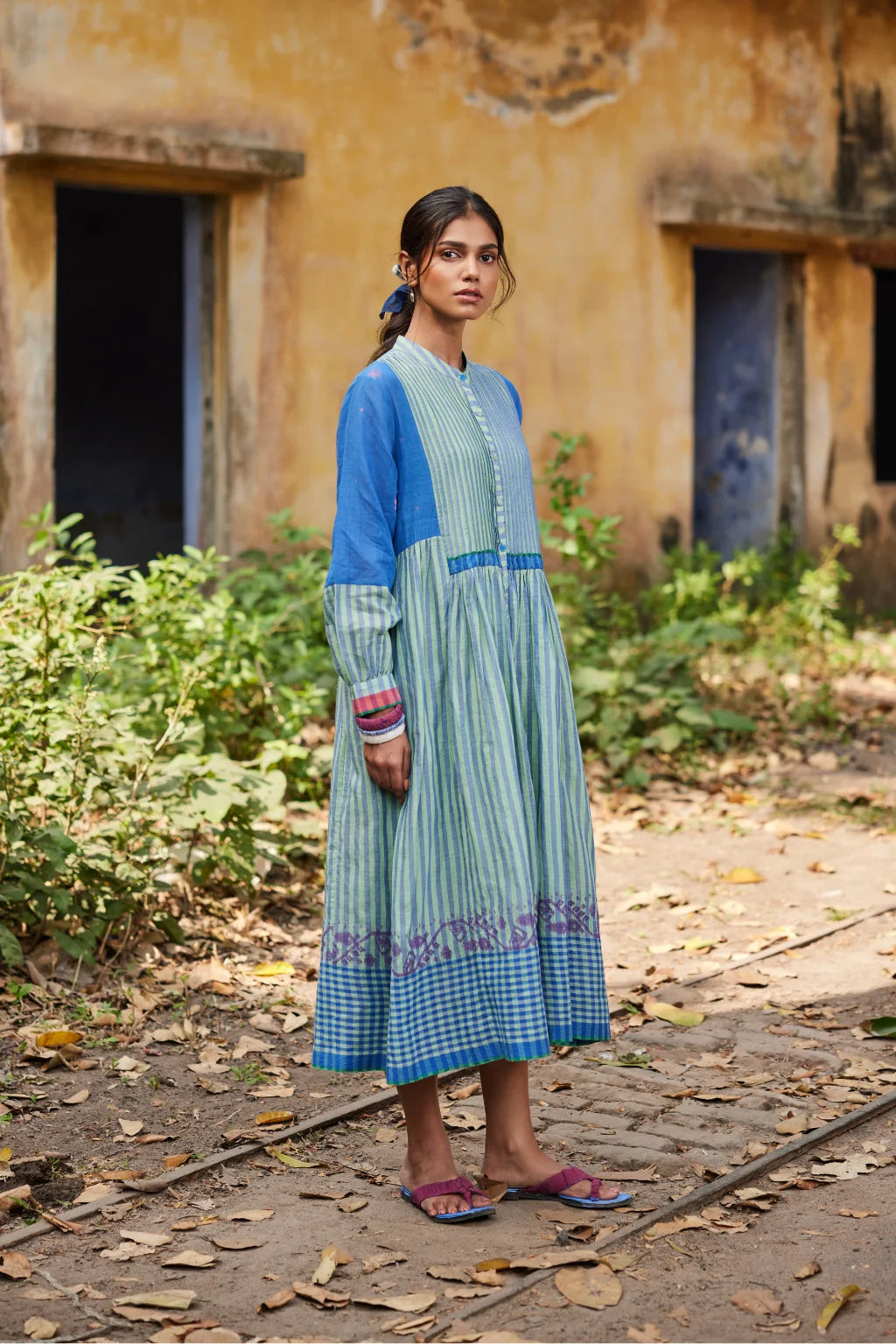 Sarron Nishita Dress, blue and green patchwork cotton Jamdani dress with geometric and floral motifs.