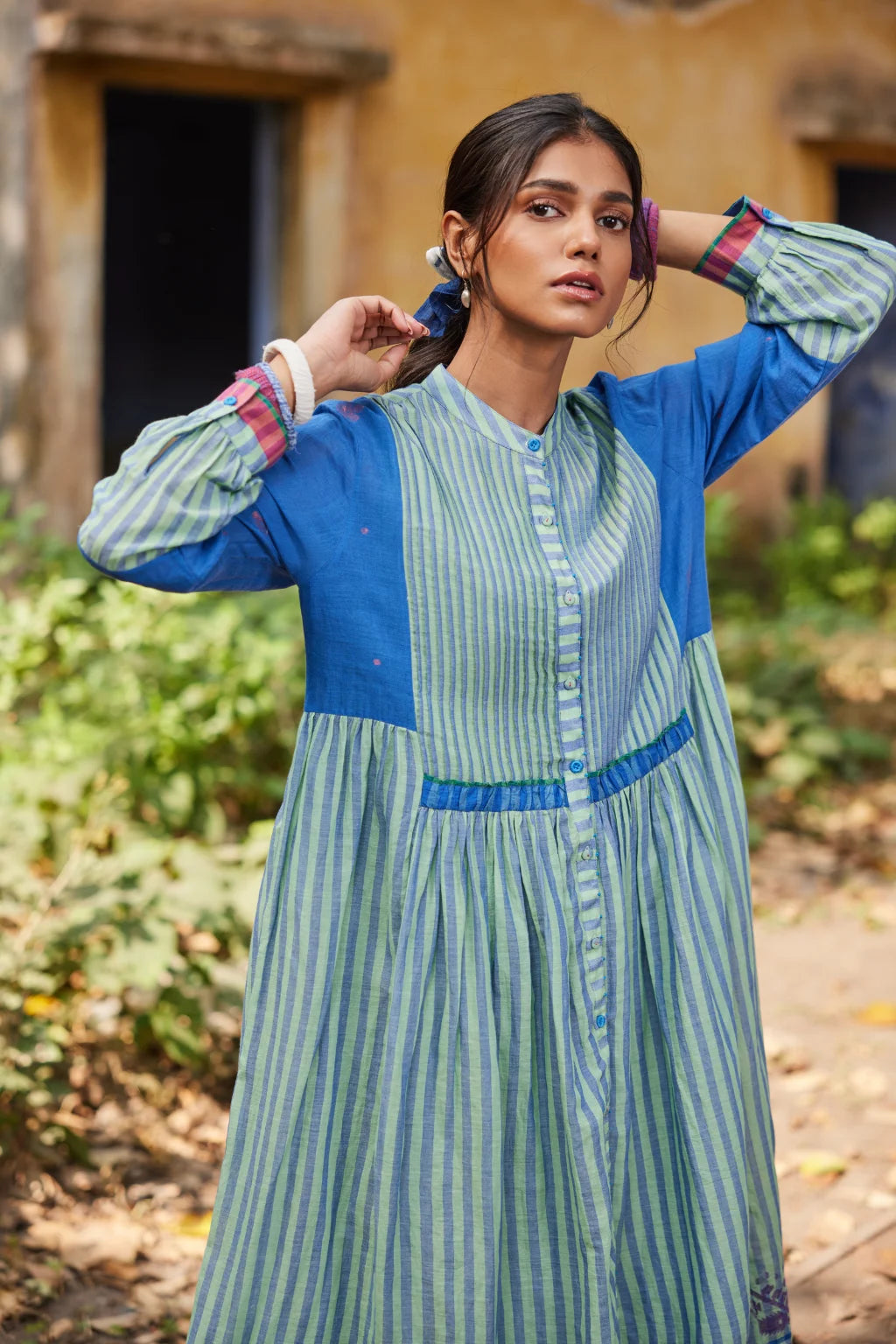 Sarron Nishita Dress, blue and green patchwork cotton Jamdani dress with geometric and floral motifs.