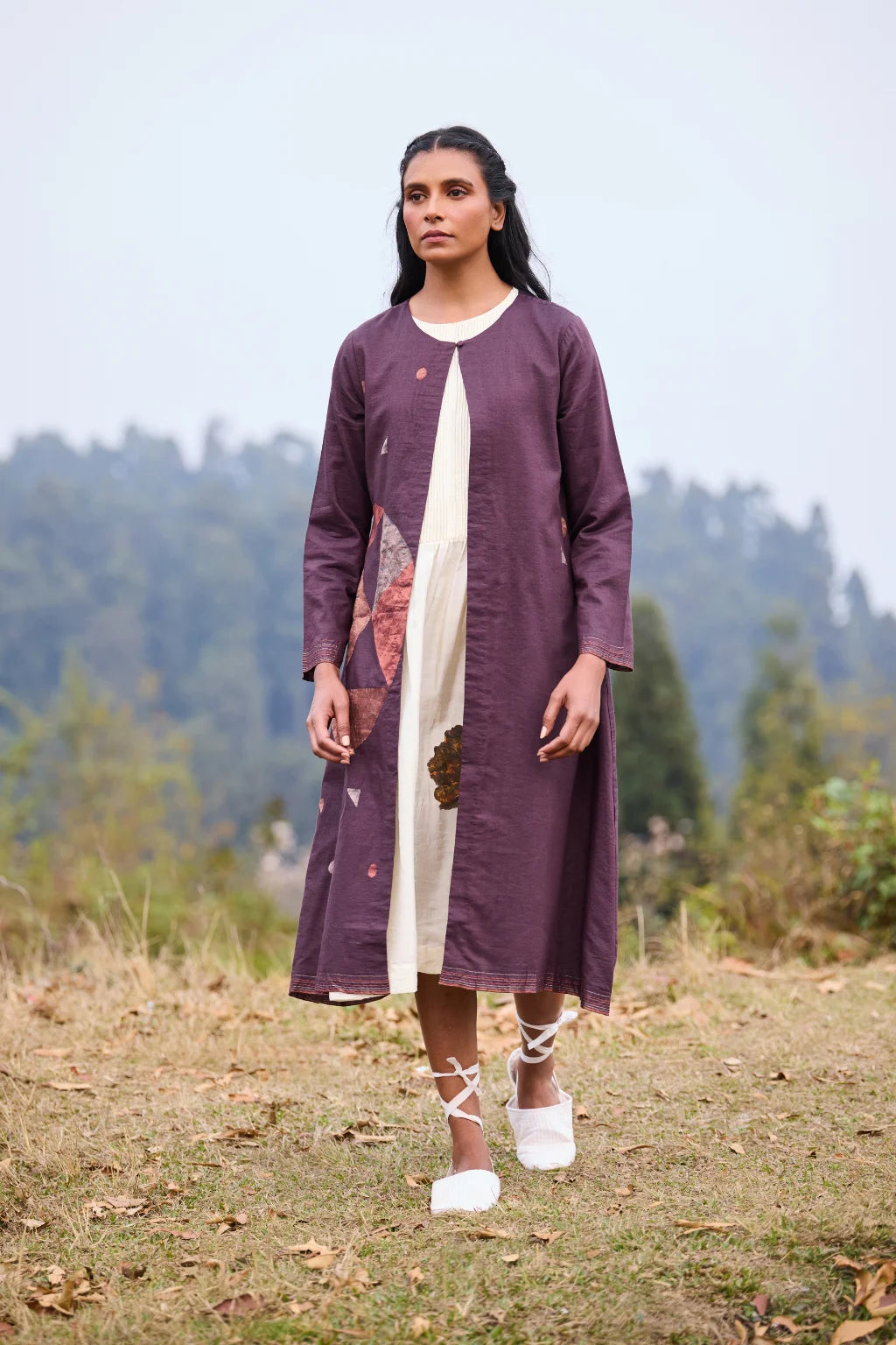 Sarron Parijat Set, ivory silk dress with hand-painted motifs and a plum silk-cotton Jamdani overlay.