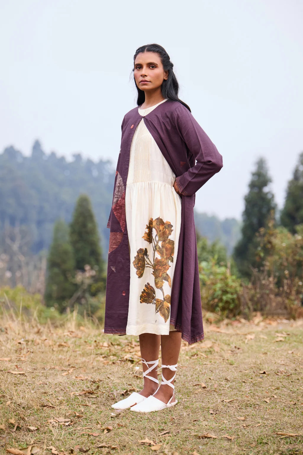 Sarron Parijat Set, ivory silk dress with hand-painted motifs and a plum silk-cotton Jamdani overlay.