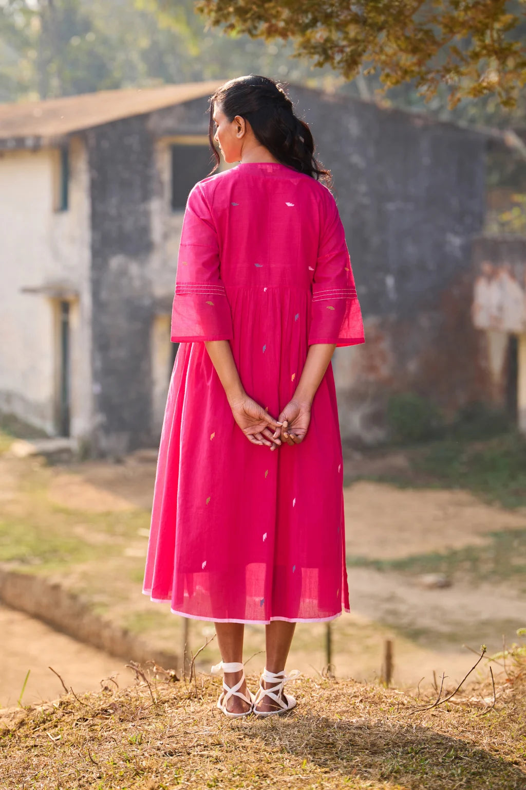 Sarron Raktima Dress, pink cotton Jamdani dress with a large geometric yoke motif and Kantha-worked sleeves.