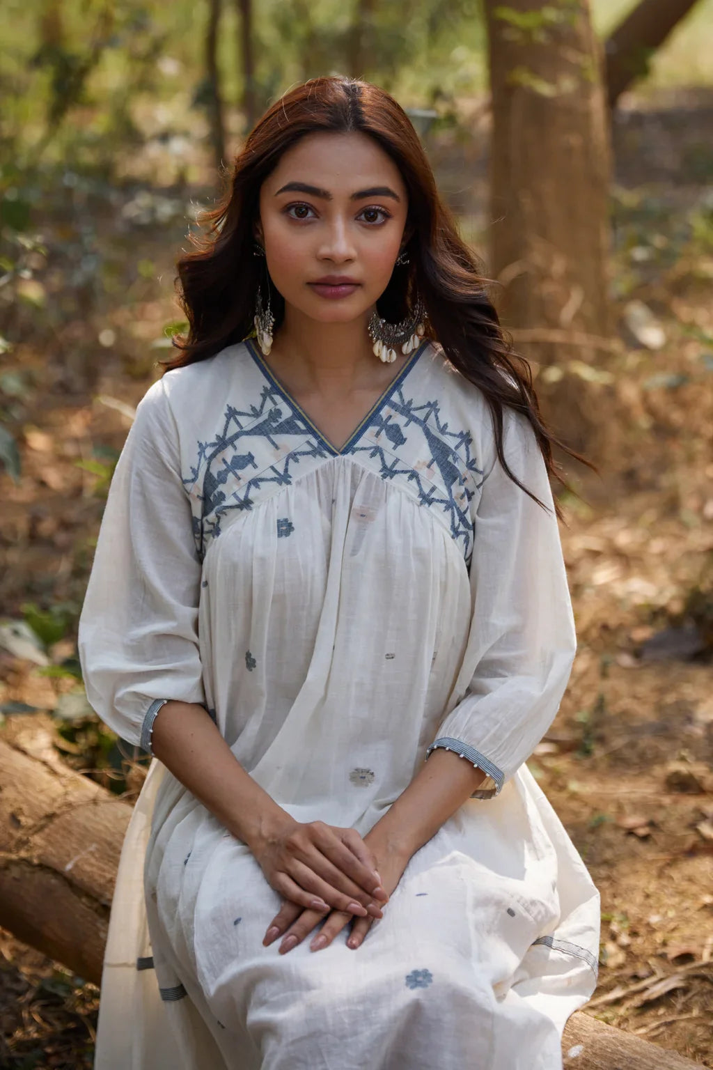 Sarron Ranjita Dress, off-white cotton Jamdani dress with handwoven blue motifs and a worked neckline.
