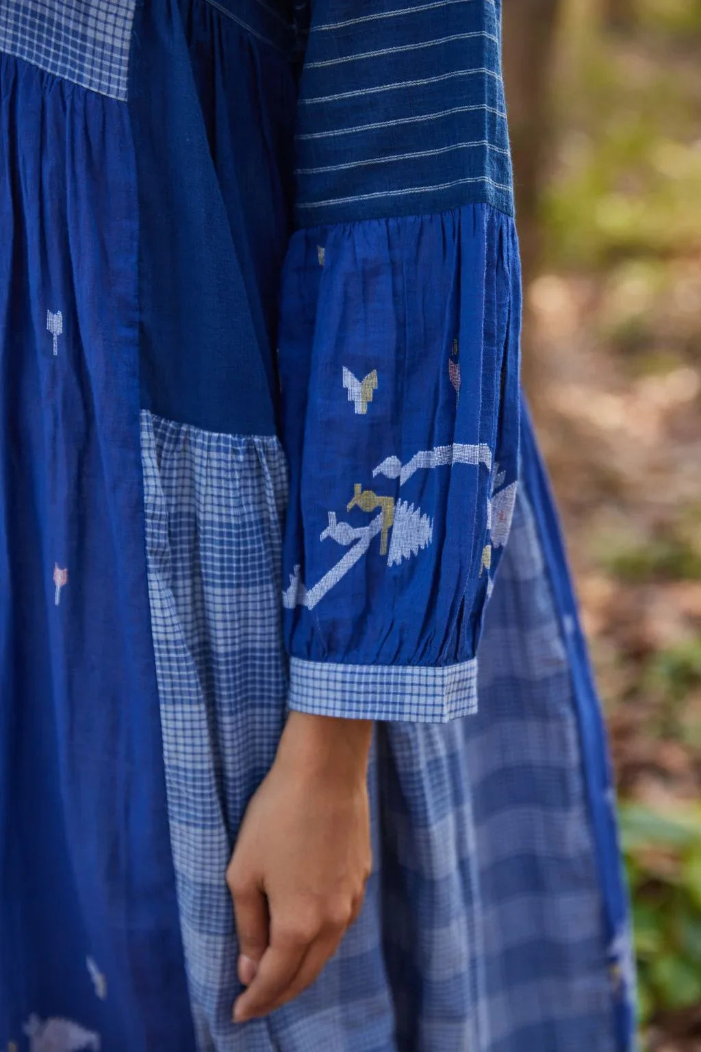 Sarron Ritu Dress, blue and grey striped cotton Jamdani maxi dress with a flared hem and side pockets.