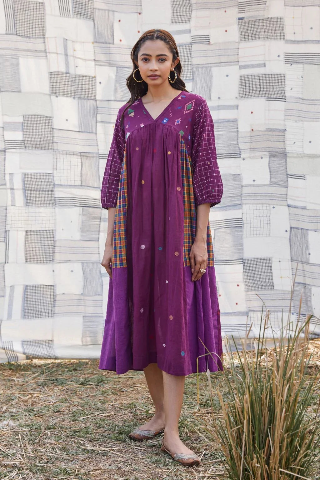 Sarron Sana Dress, red cotton Jamdani dress with multicoloured stripe panels and a V-neckline.