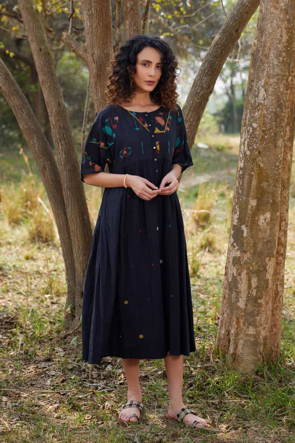 Sarron Shila Dress, solid black cotton Jamdani dress, calf length with a round neck and half sleeves.