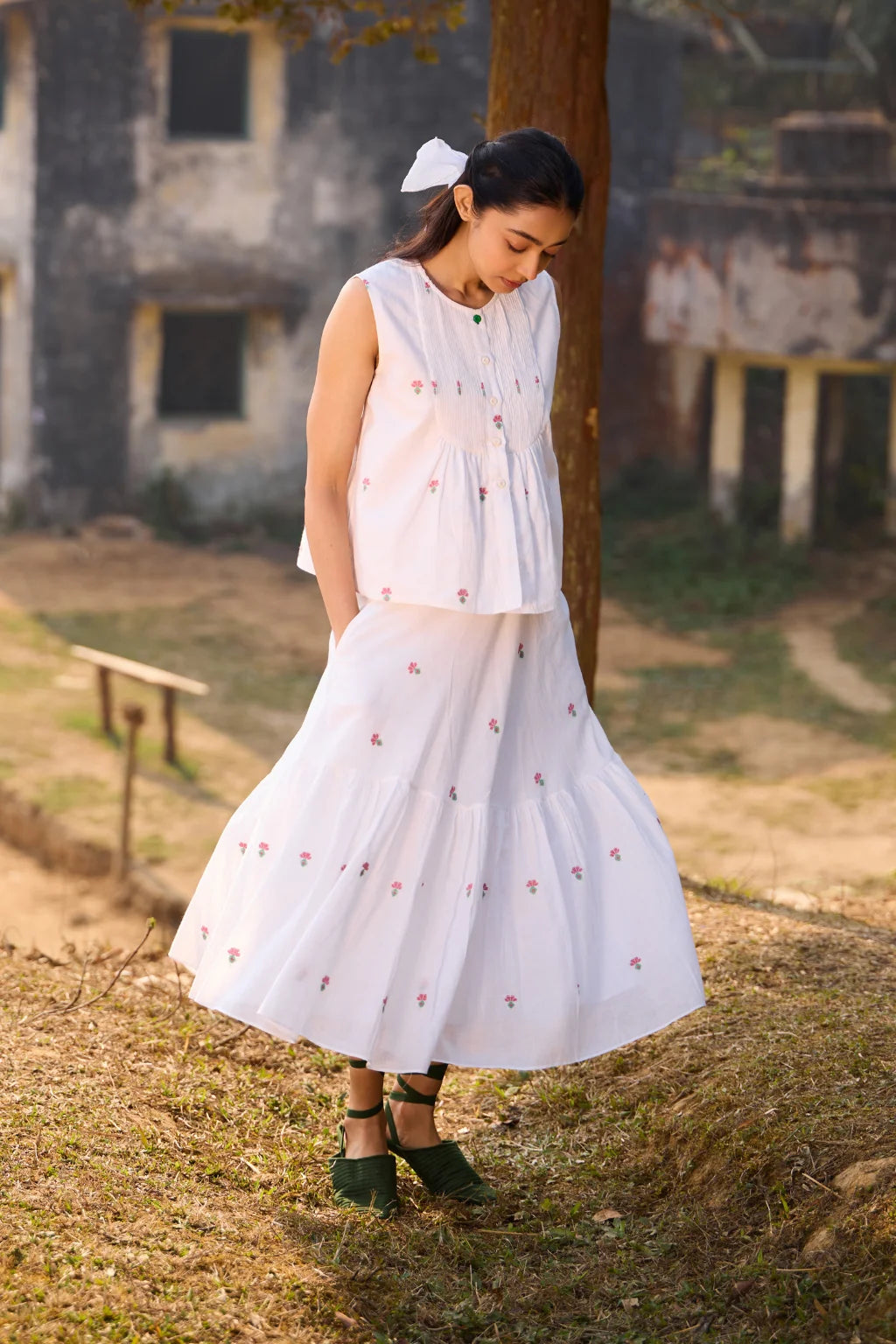 Sarron Shiuli Skirt, white flared cotton Jamdani skirt with geometric flower motifs and side pockets.