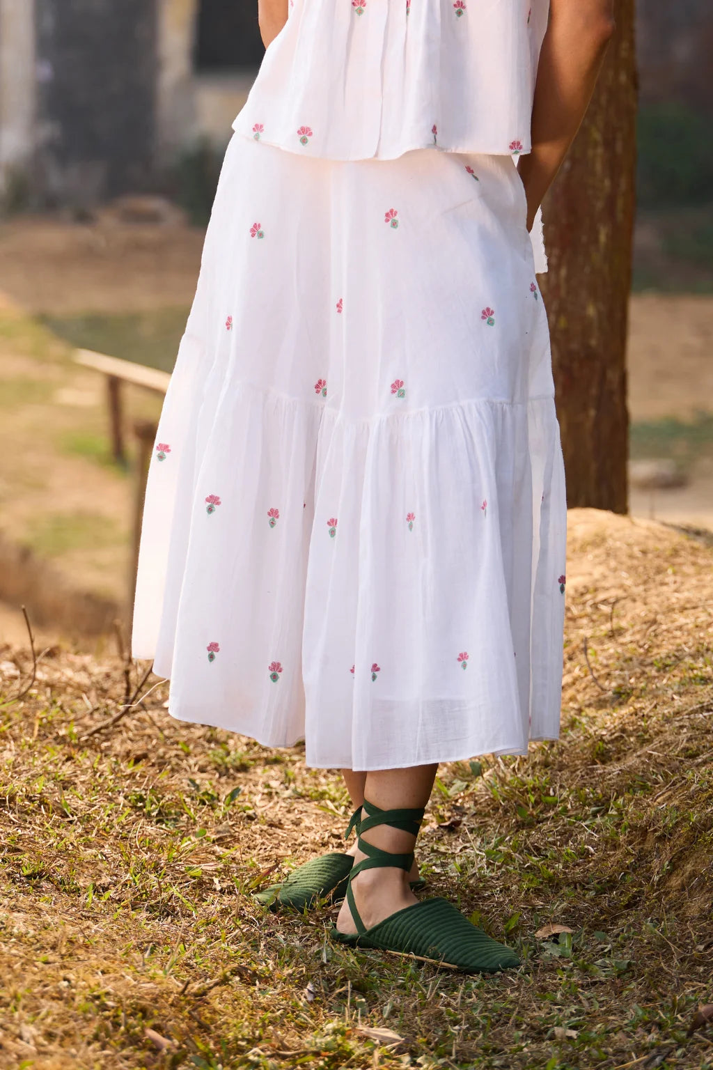 Sarron Shiuli Skirt, white flared cotton Jamdani skirt with geometric flower motifs and side pockets.