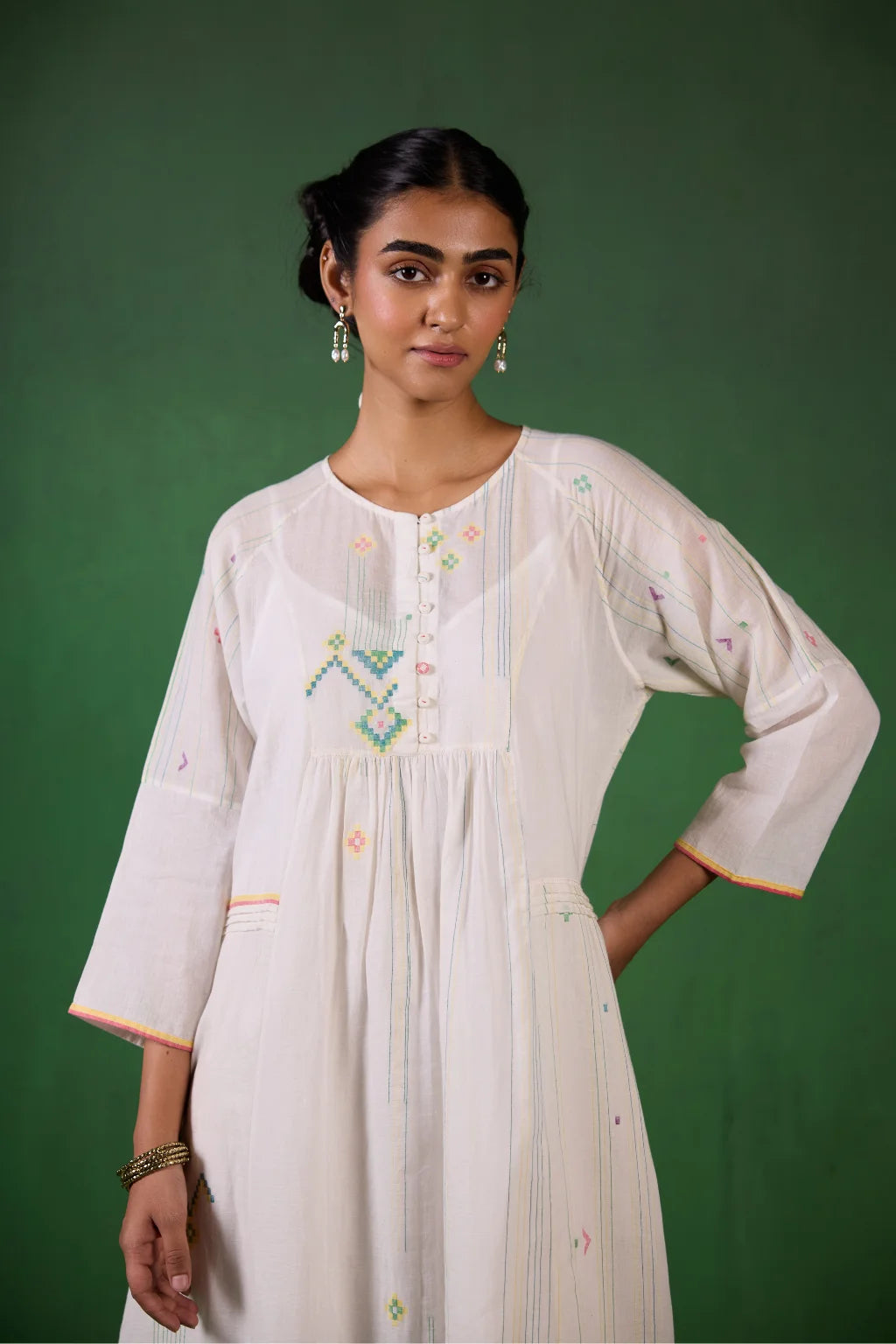 Sarron Shuchi Dress, soft white silk-cotton Jamdani dress with large handwoven motifs and raglan sleeves.