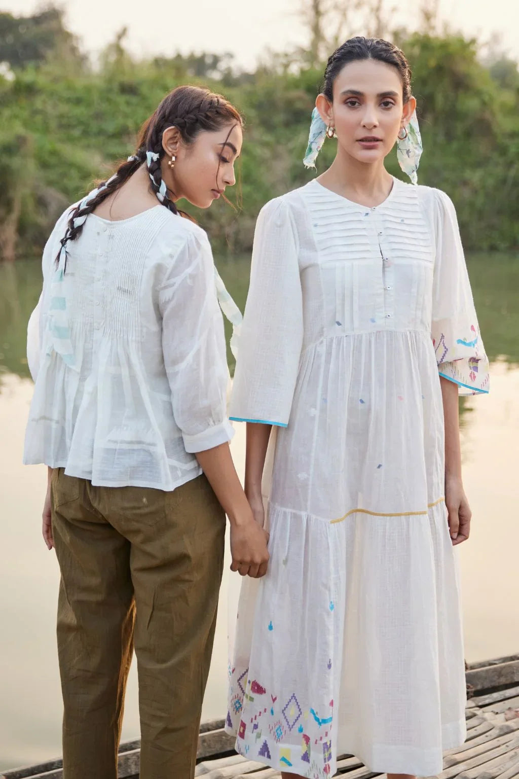 Sarron Sneha Dress, white cotton Jamdani dress with a pleated fall, round neck and waist smocking.