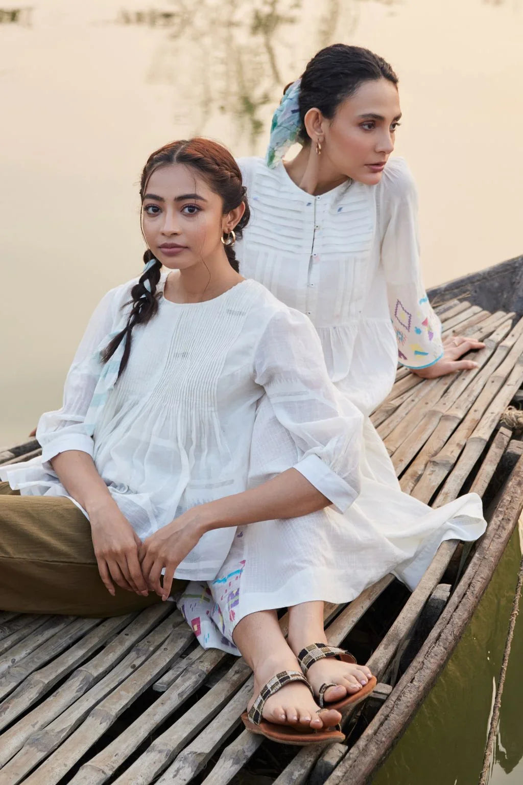 Sarron Sneha Dress, white cotton Jamdani dress with a pleated fall, round neck and waist smocking.