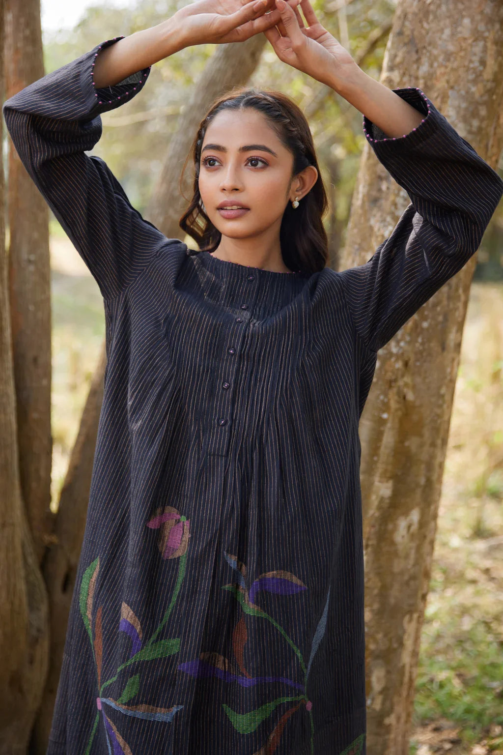 Sarron Sumi Dress, black silk-cotton Jamdani dress with golden stripes and scattered floral motifs.