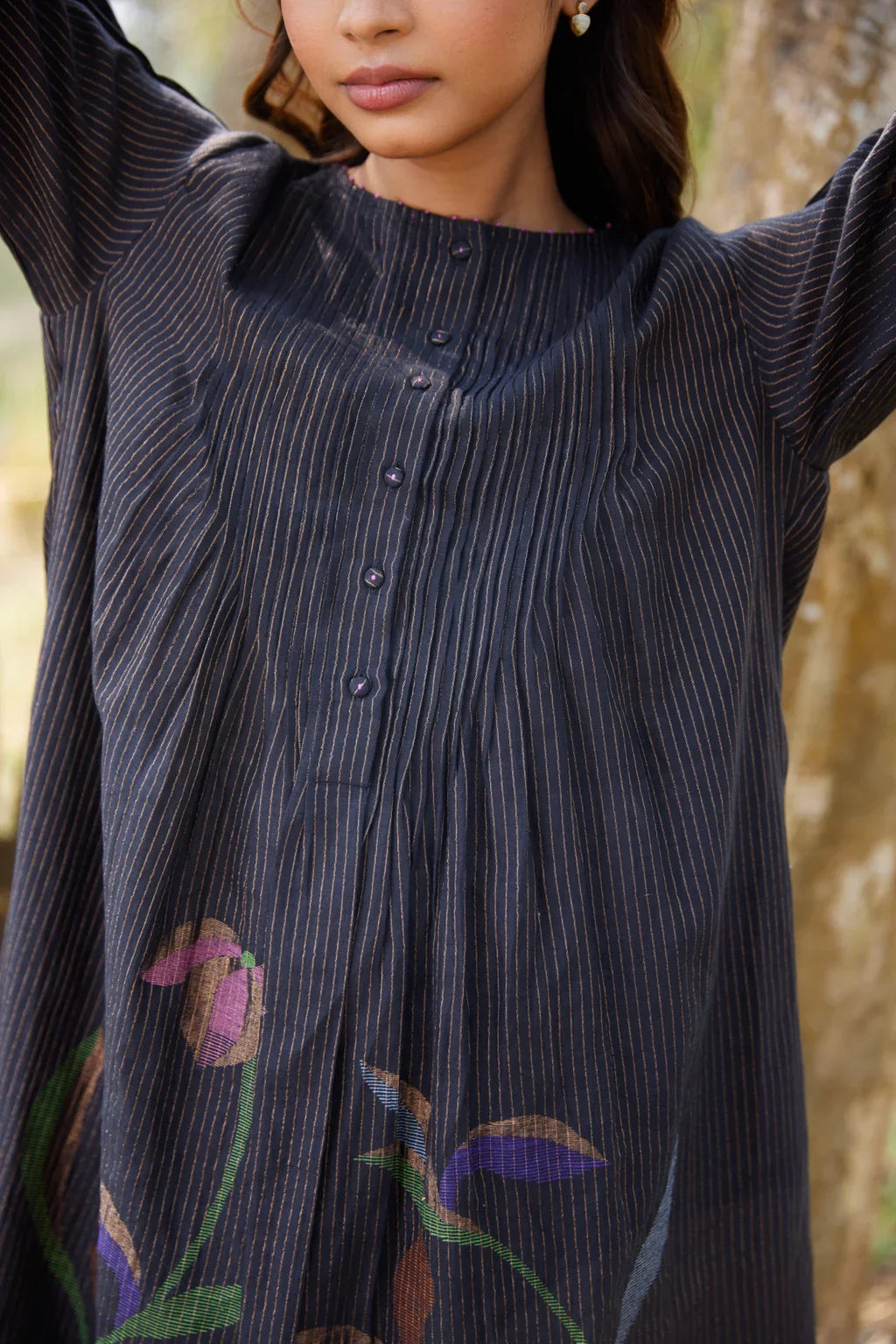 Sarron Sumi Dress, black silk-cotton Jamdani dress with golden stripes and scattered floral motifs.