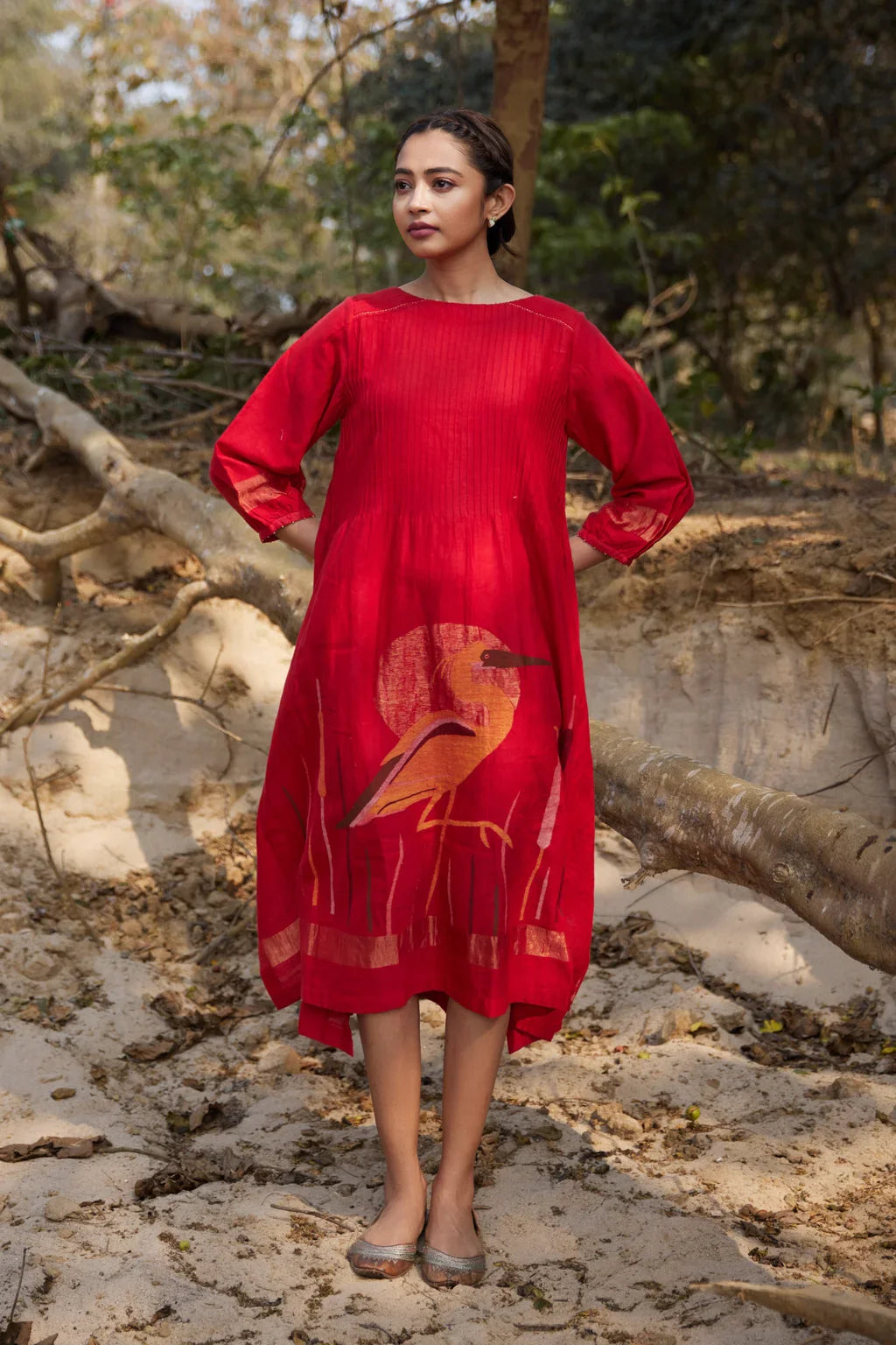 Sarron Susmita Dress, red silk-cotton Jamdani dress with a handwoven flamingo motif and a flared hem.