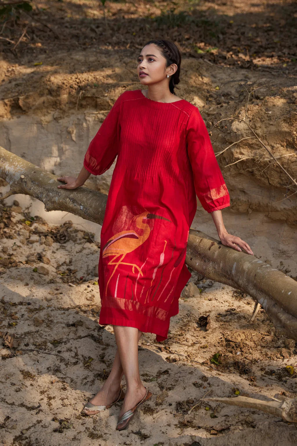 Sarron Susmita Dress, red silk-cotton Jamdani dress with a handwoven flamingo motif and a flared hem.