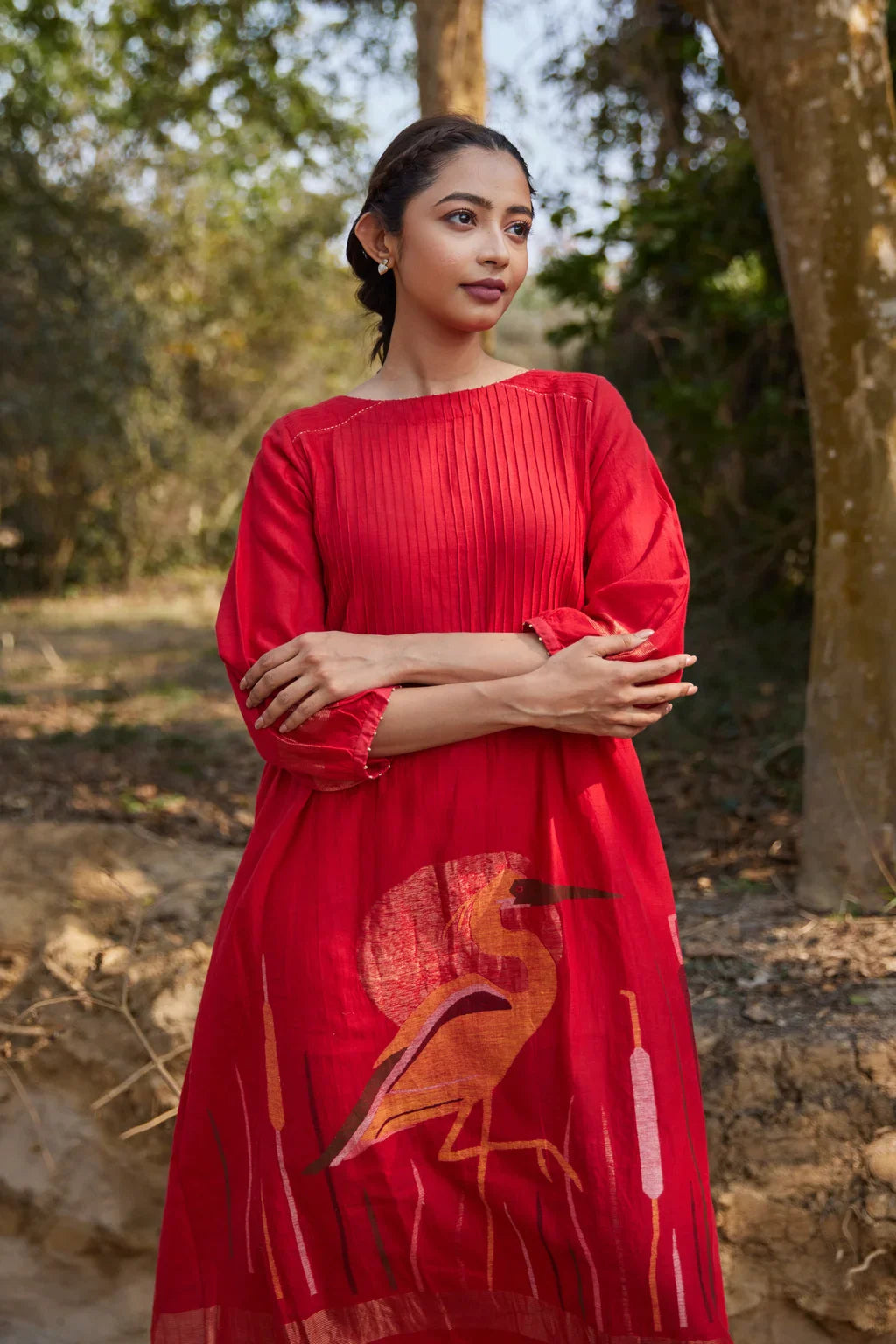 Sarron Susmita Dress, red silk-cotton Jamdani dress with a handwoven flamingo motif and a flared hem.