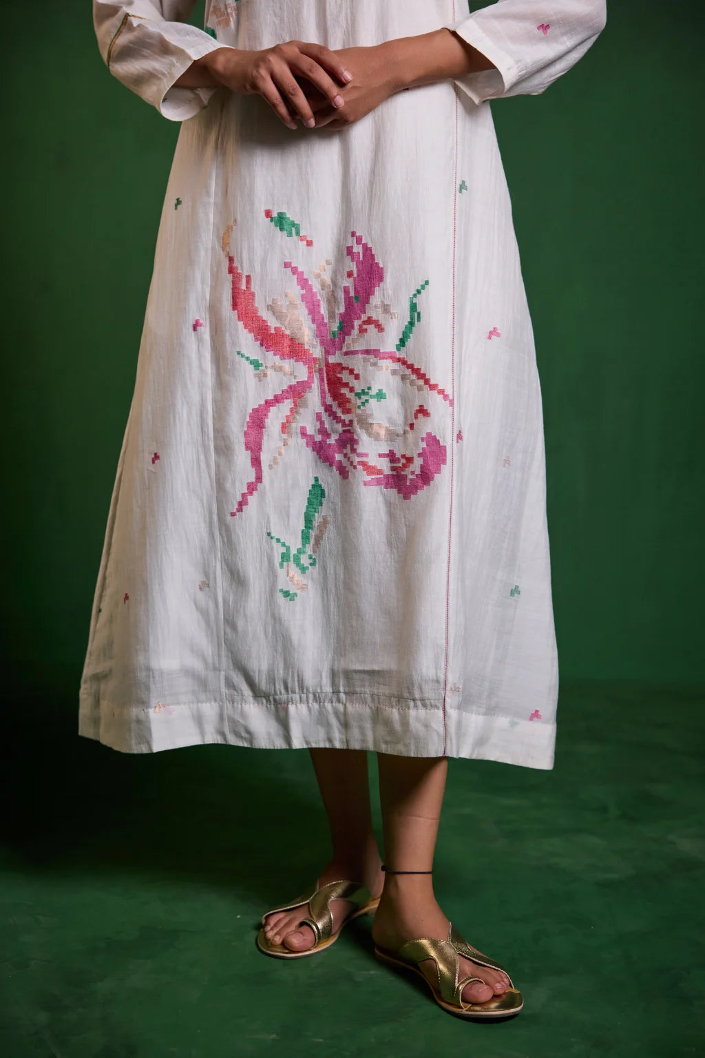 Sarron Uma Dress, white silk-cotton Jamdani dress with large floral graph motifs and a split neckline.