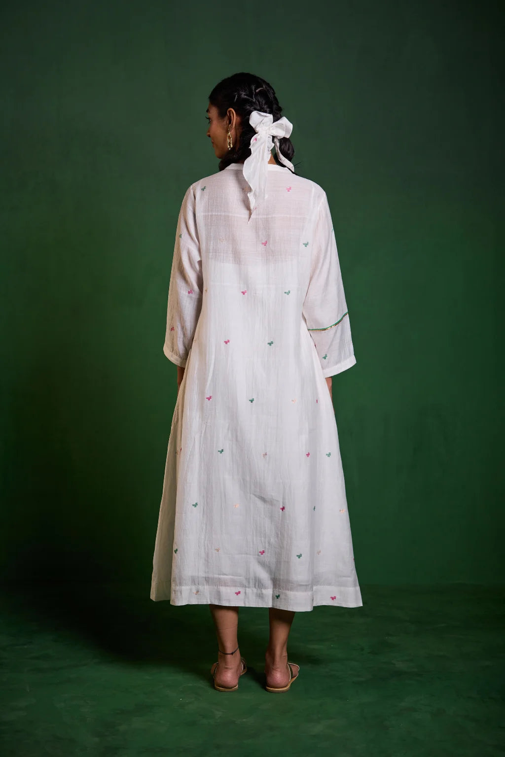 Sarron Uma Dress, white silk-cotton Jamdani dress with large floral graph motifs and a split neckline.