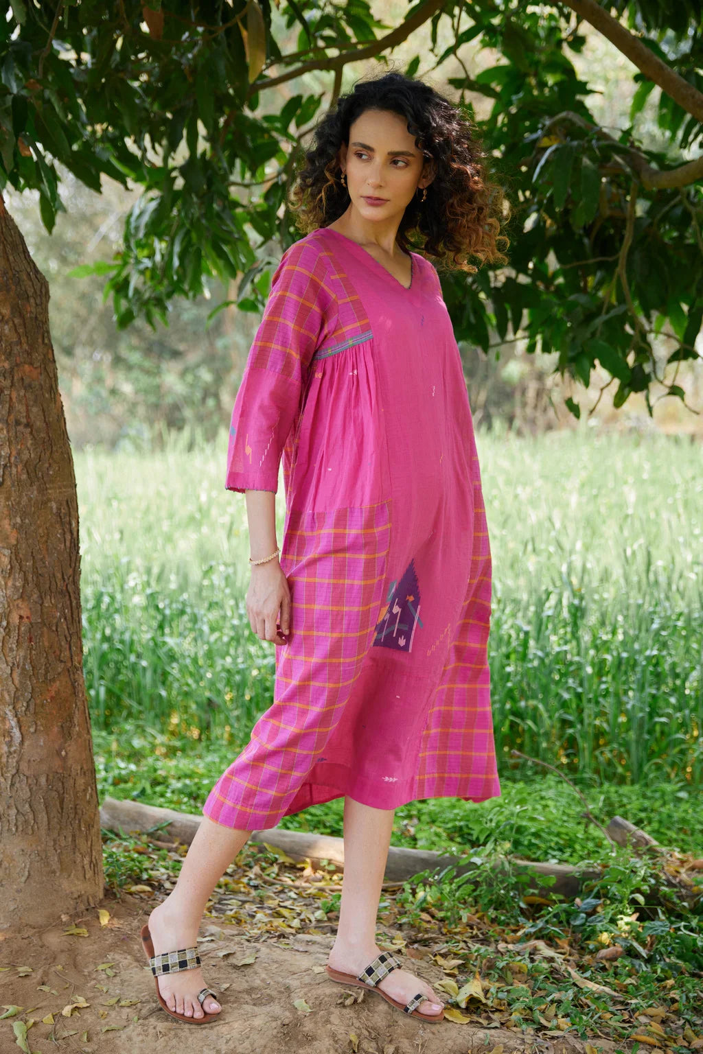 Sarron Amoli Dress, pink cotton Jamdani maxi dress with solid and checked panels and waist smocking.