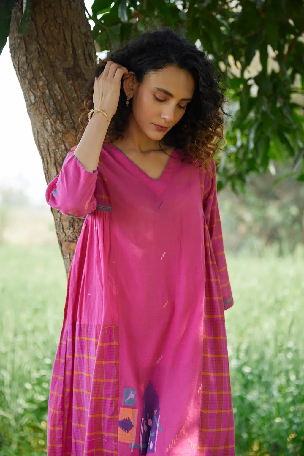 Sarron Amoli Dress, pink cotton Jamdani maxi dress with solid and checked panels and waist smocking.