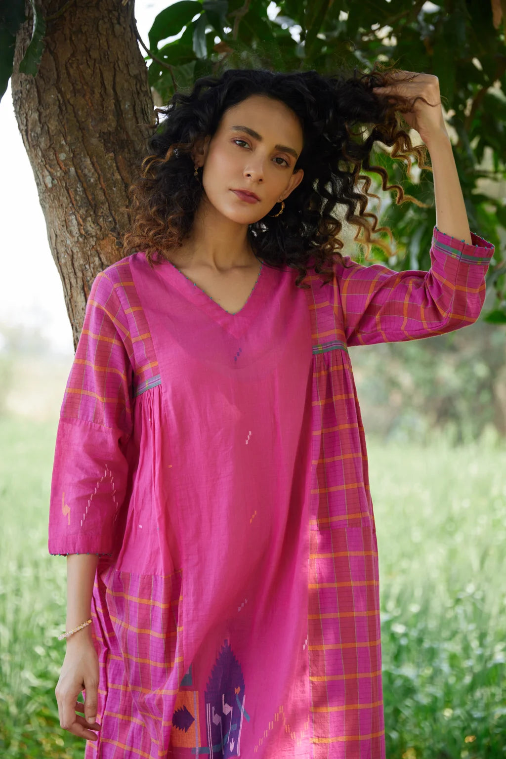 Sarron Amoli Dress, pink cotton Jamdani maxi dress with solid and checked panels and waist smocking.
