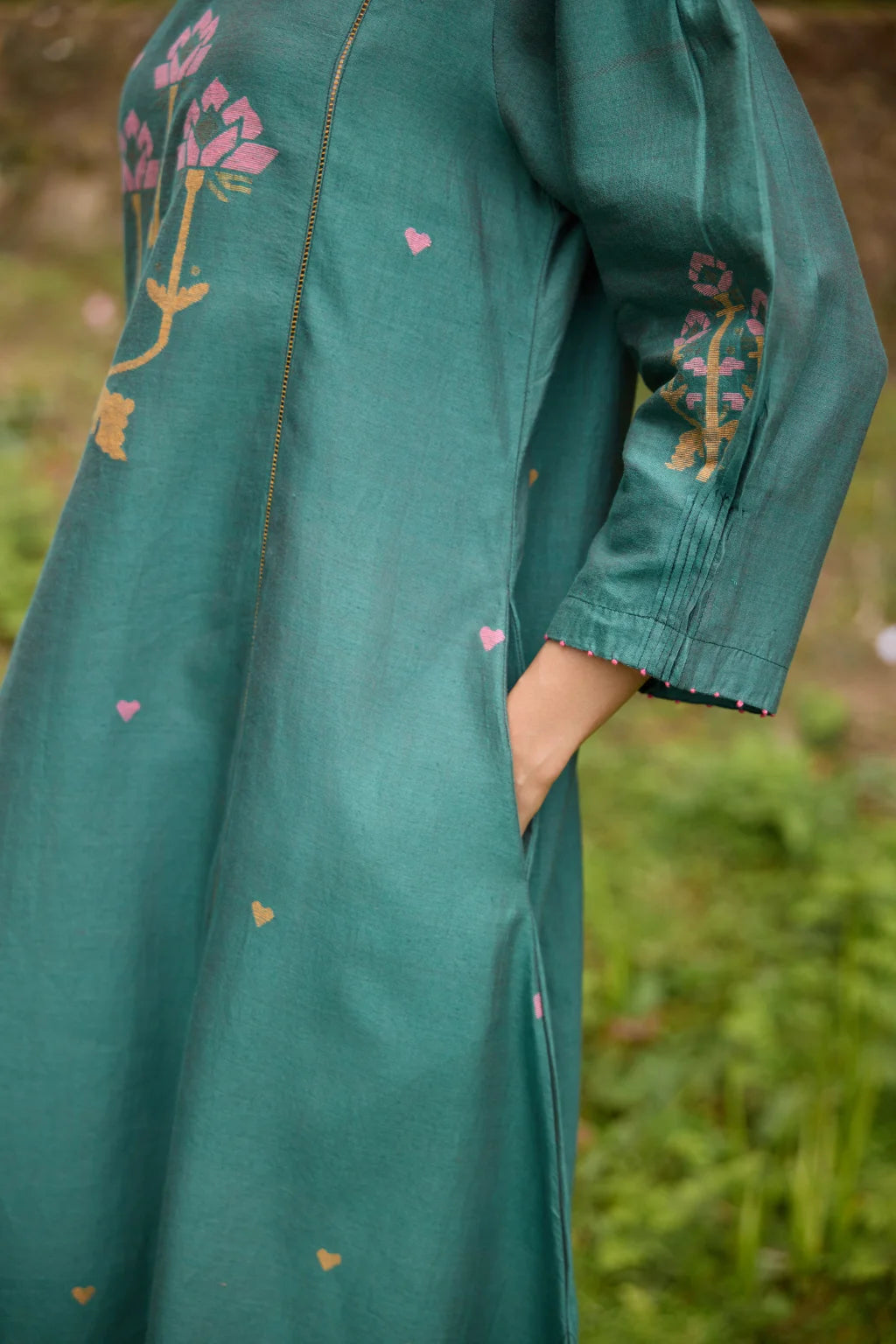 Sarron Anitha Dress, forest green silk-cotton Jamdani panelled dress with floral and heart-shaped motifs.