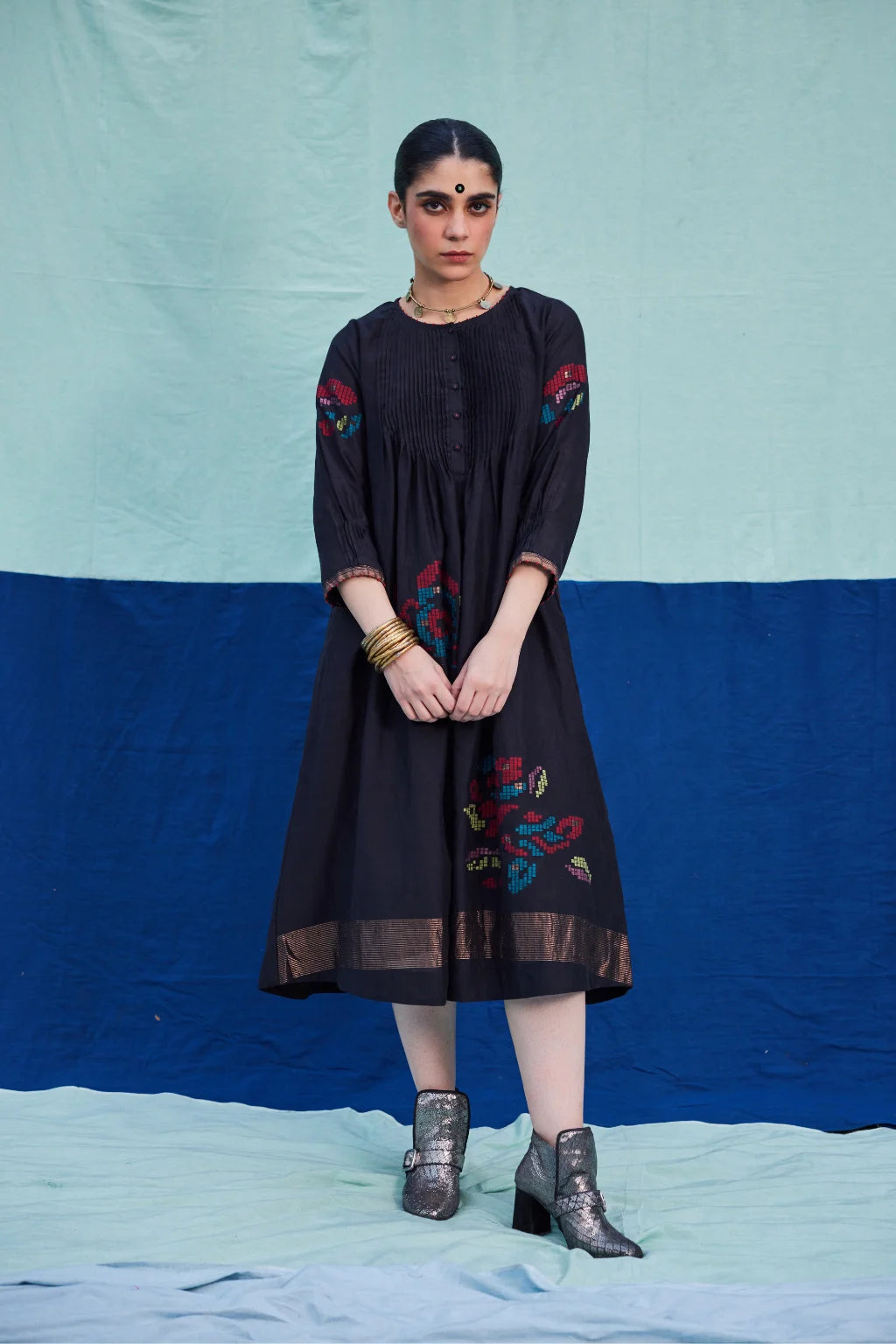 Sarron Bindu Dress, black silk-cotton Jamdani dress with large multicoloured graph butas and pintucks.