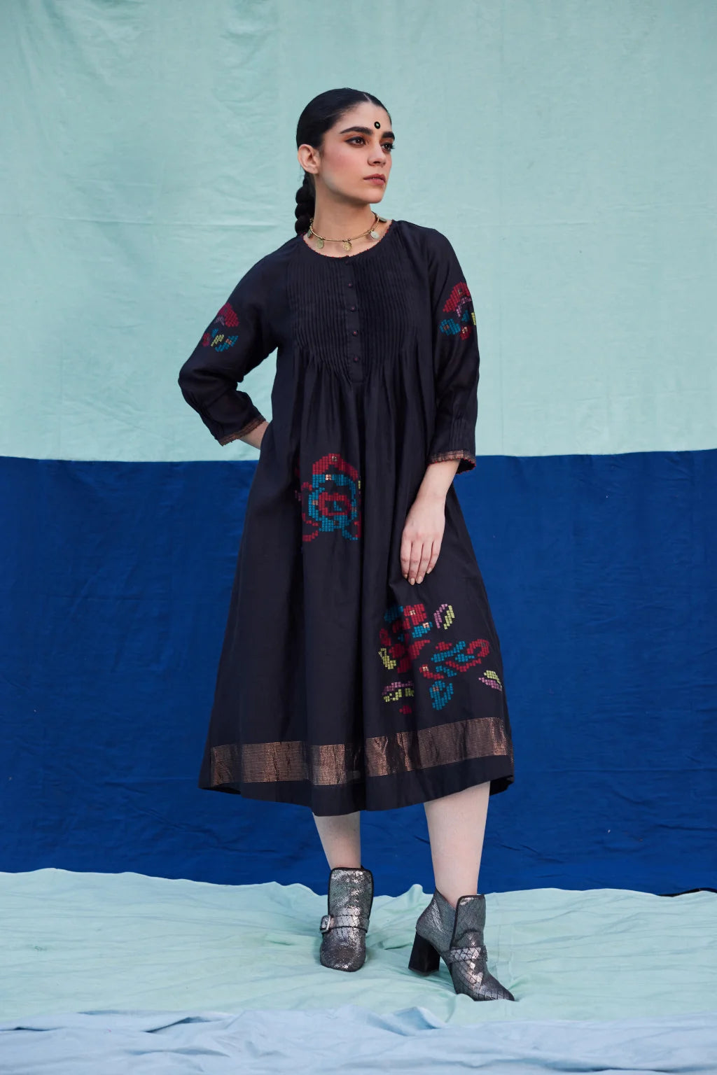 Sarron Bindu Dress, black silk-cotton Jamdani dress with large multicoloured graph butas and pintucks.