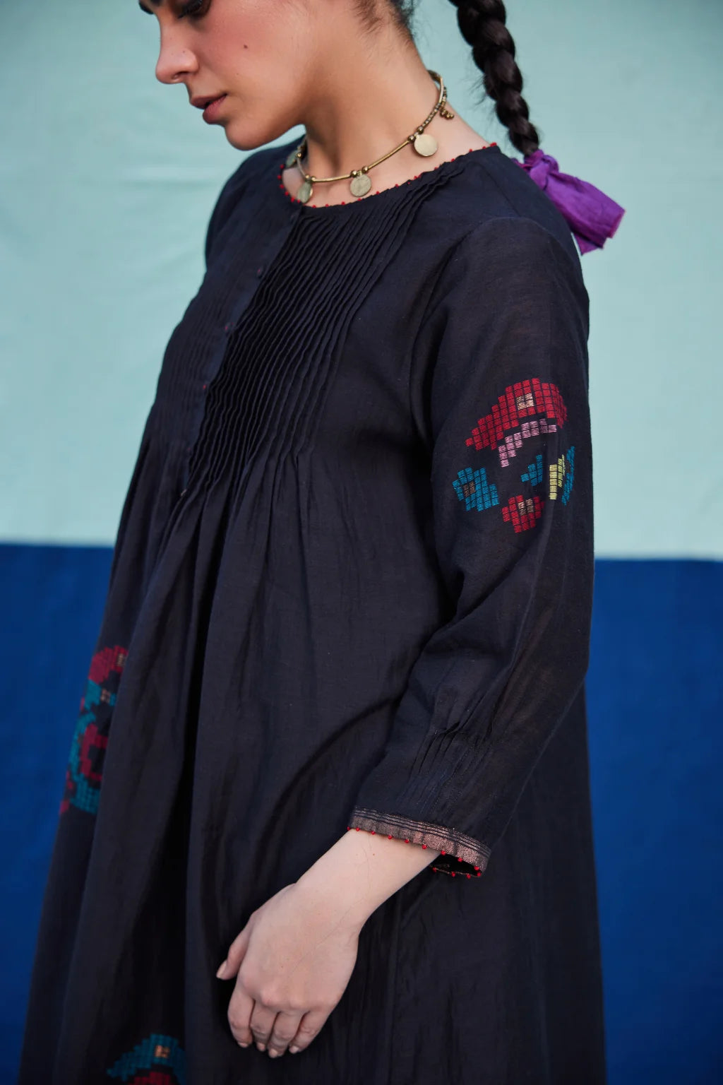 Sarron Bindu Dress, black silk-cotton Jamdani dress with large multicoloured graph butas and pintucks.