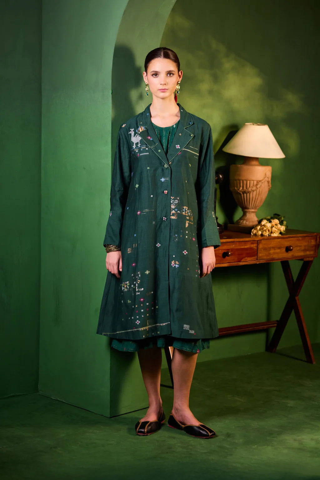 Sarron Garima Set, deep green silk-cotton Jamdani jacket and dress with handwoven peacock and lion motifs.