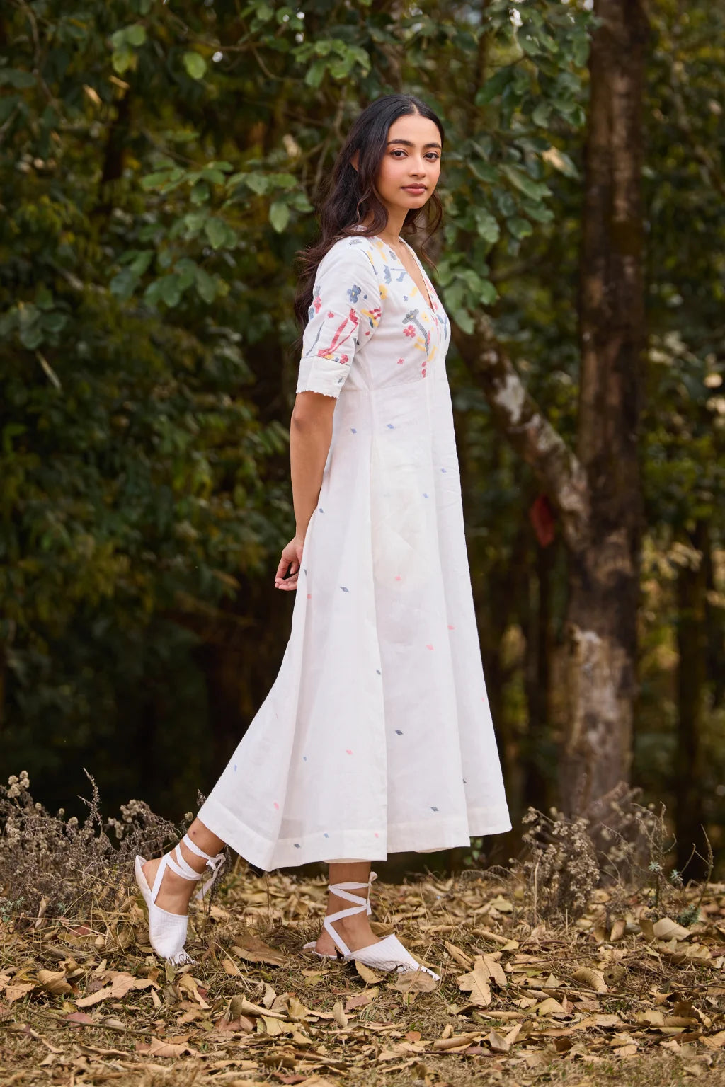 Sarron Giribala Dress, white cotton Jamdani A-line dress with handwoven floral motifs and beaded neckline.